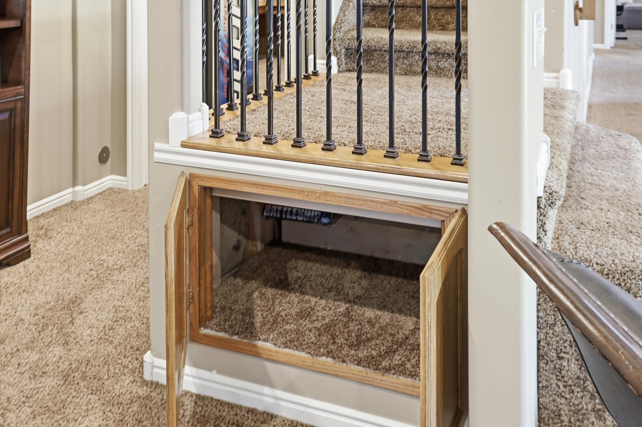Under-stair storage cabinet with wood-finish doors