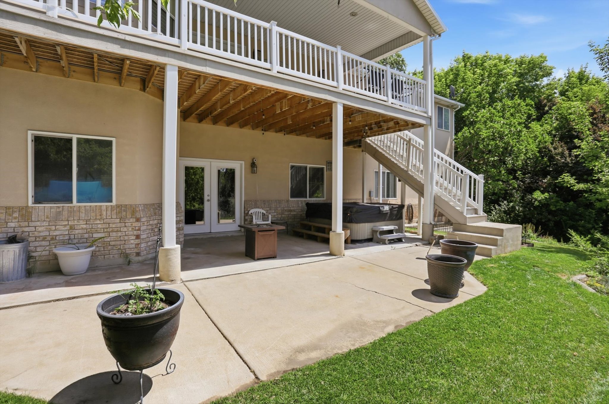 Lower-level patio with direct outdoor access via double French doors