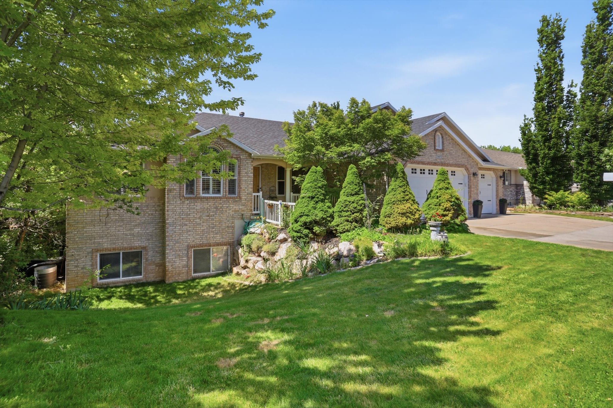 Brick exterior residence featuring a gabled roofline and multiple windows