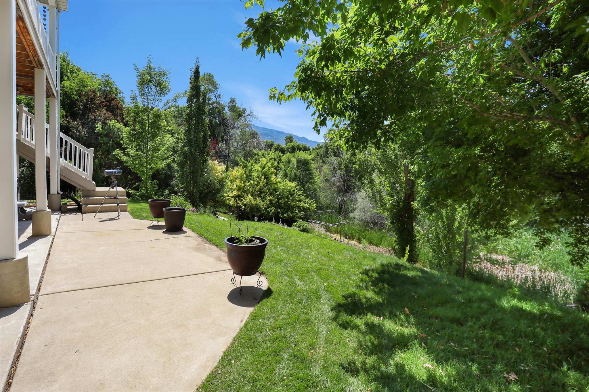 Concrete patio with direct access to a manicured lawn