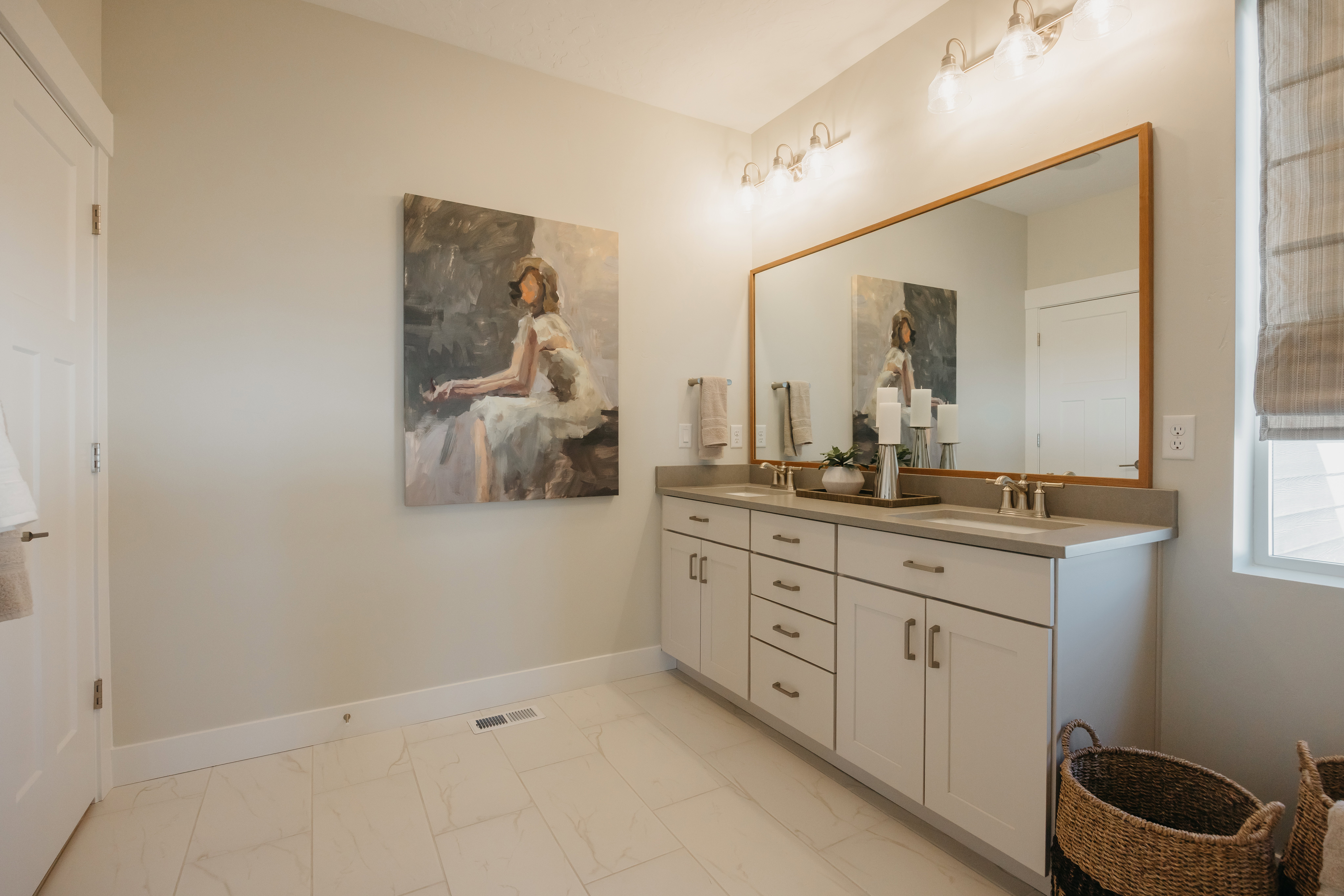 Dual vanity with white cabinetry and brushed nickel hardware