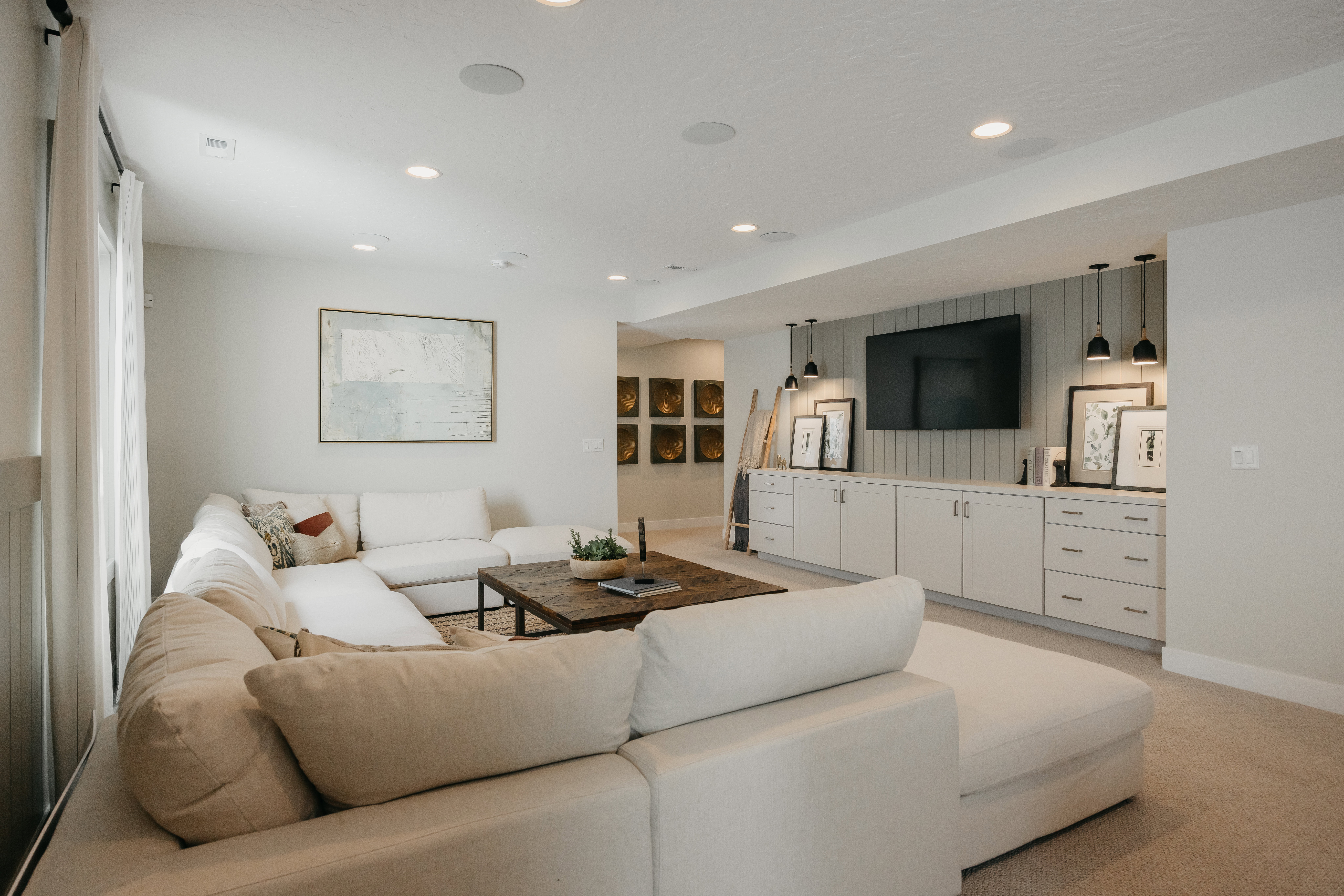 Carpeted living area featuring recessed lighting