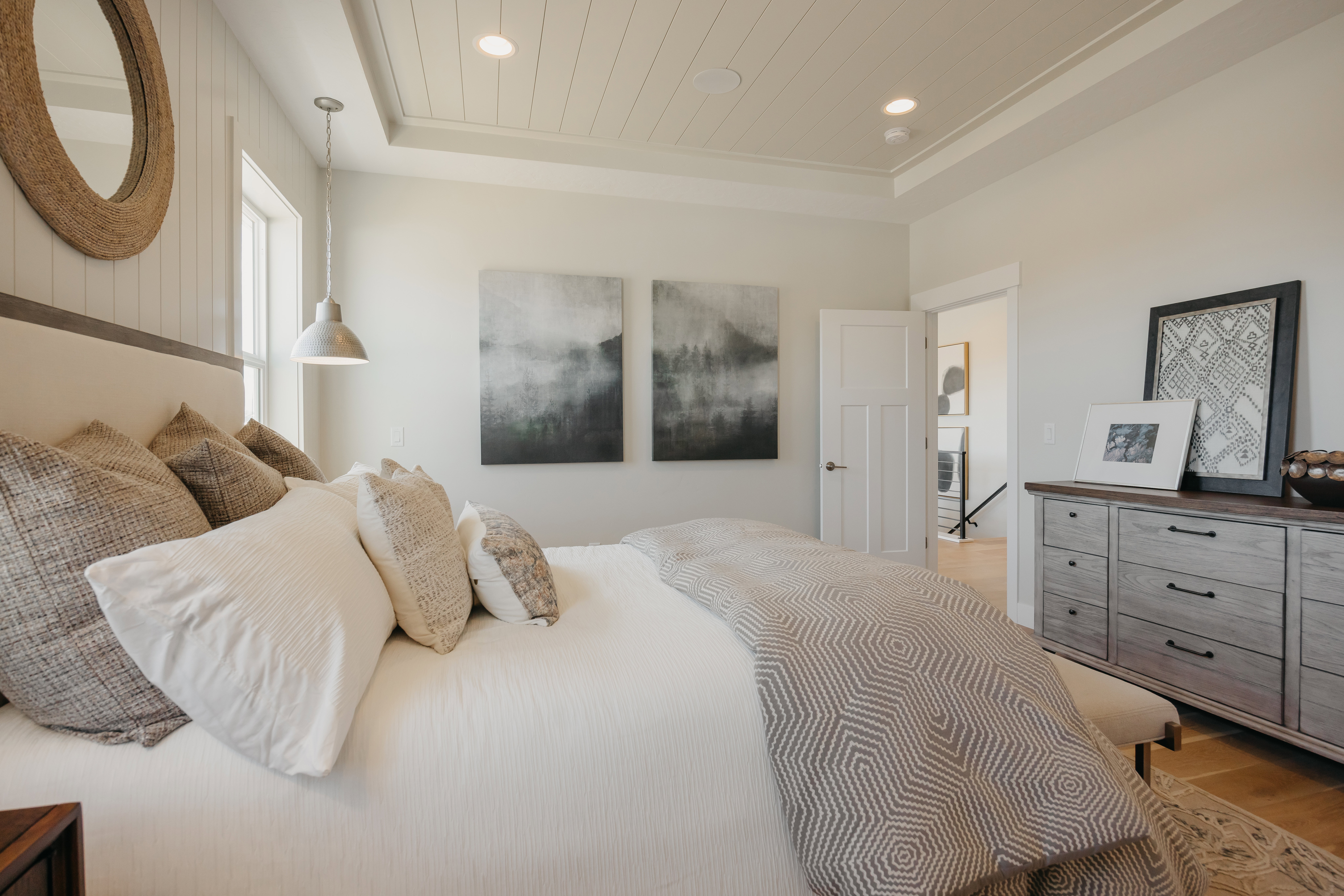 Recessed lighting and shiplap ceiling details with a window providing natural light