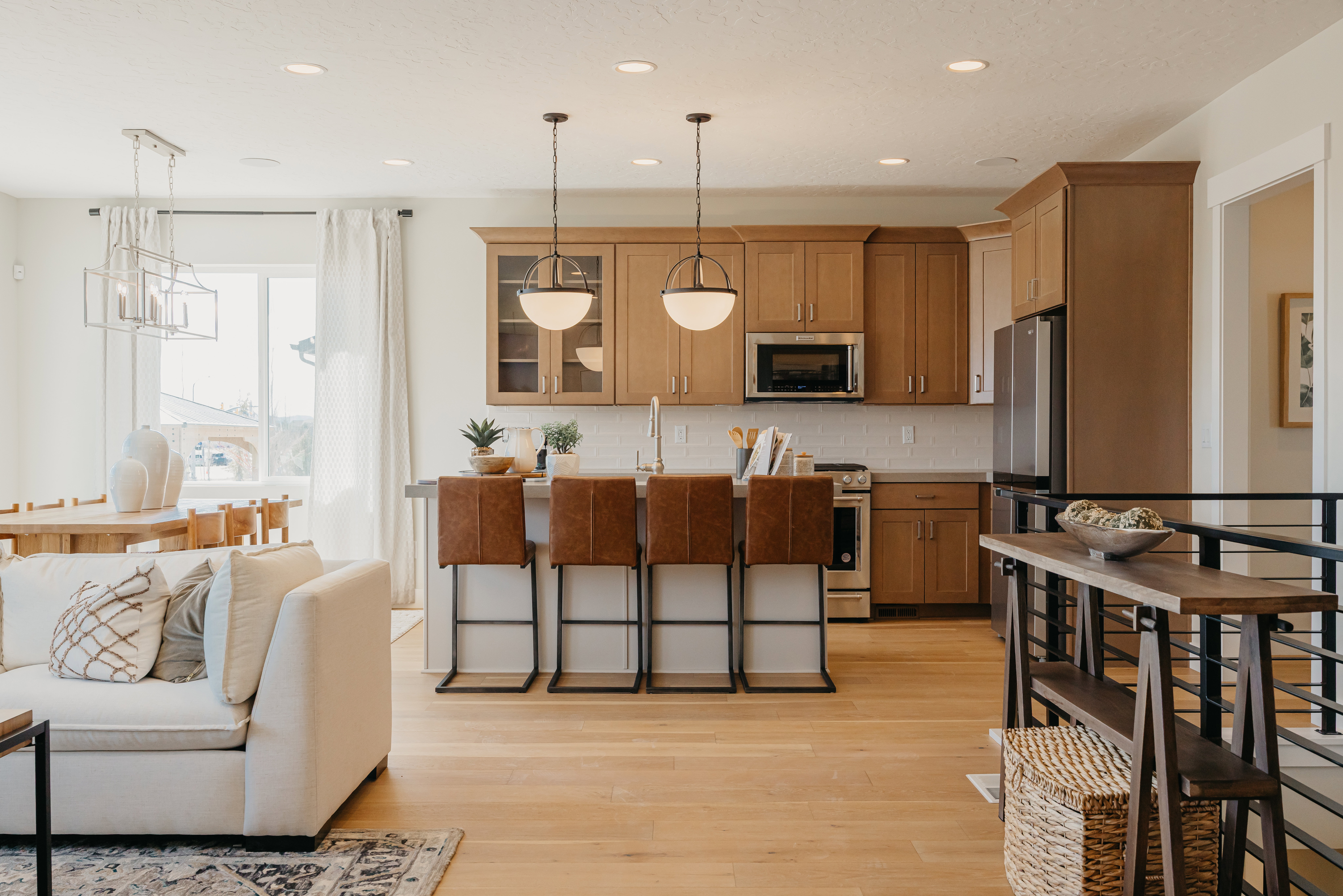 Open-concept interior featuring light wood-finish flooring throughout
