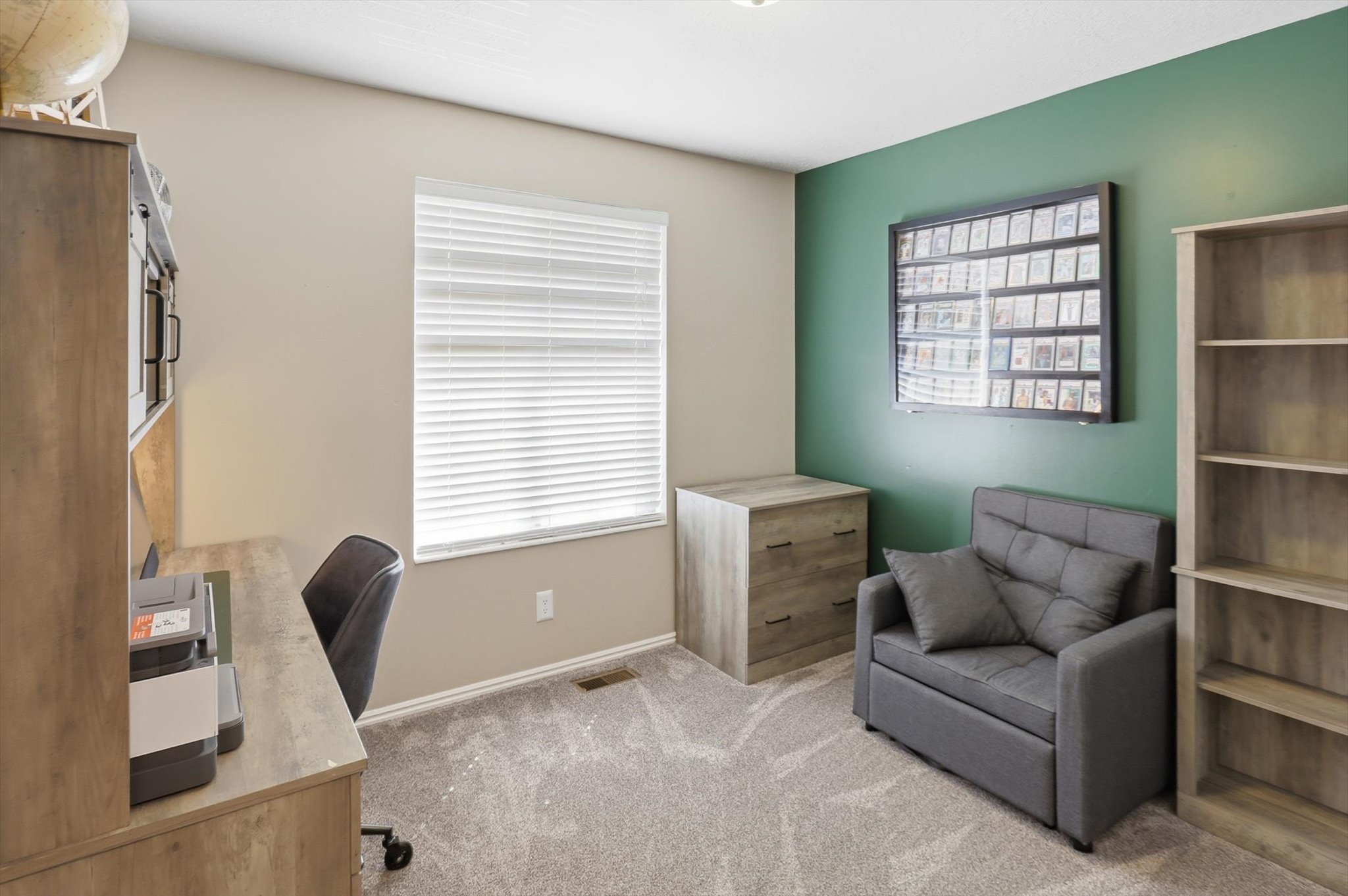 Dedicated room with light-toned walls and a contrasting accent wall
