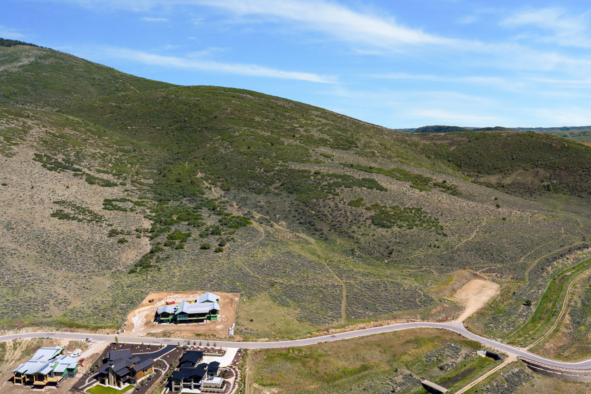 Expansive undeveloped hillside land with existing road infrastructure