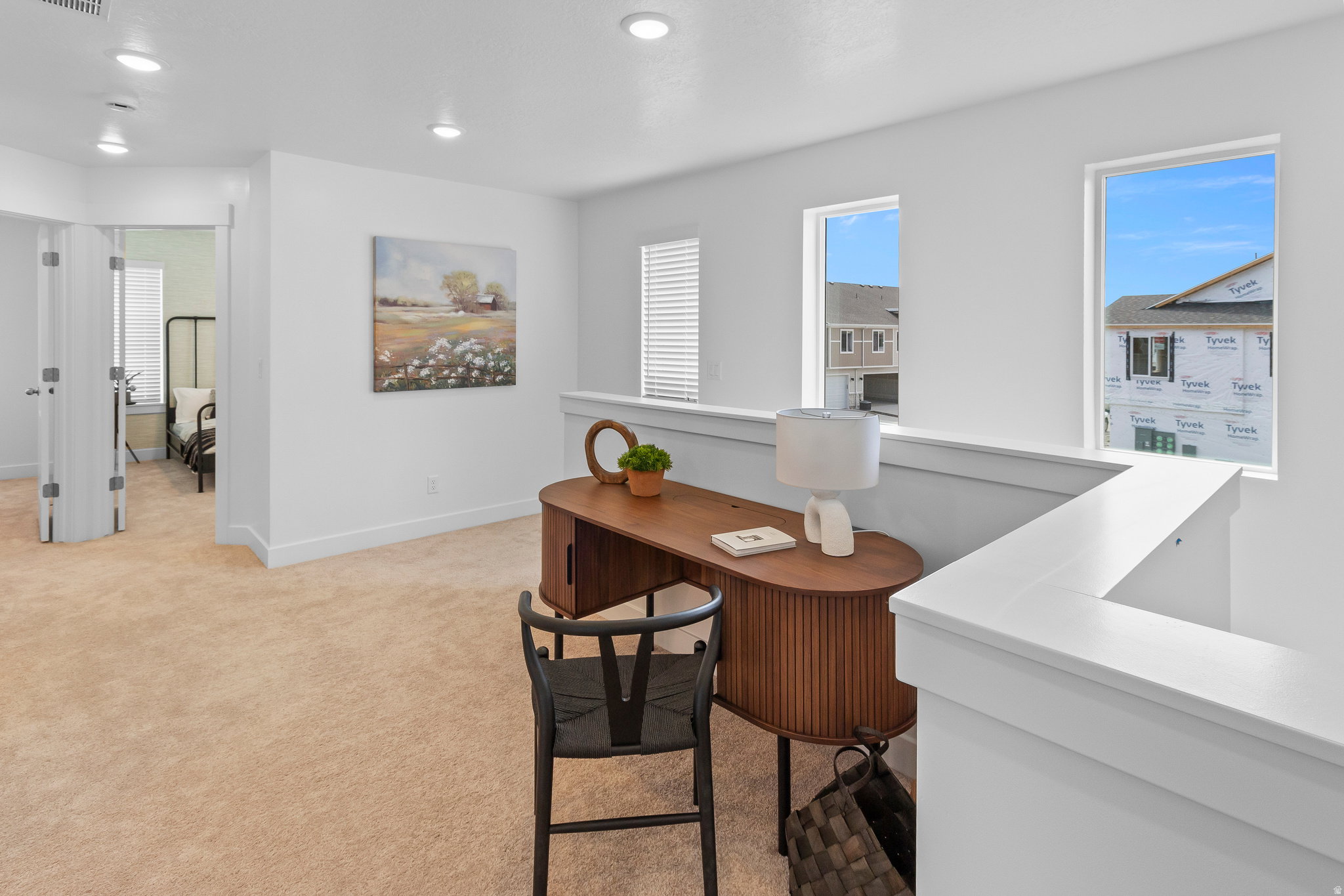 Open loft area featuring recessed lighting and plush carpeting