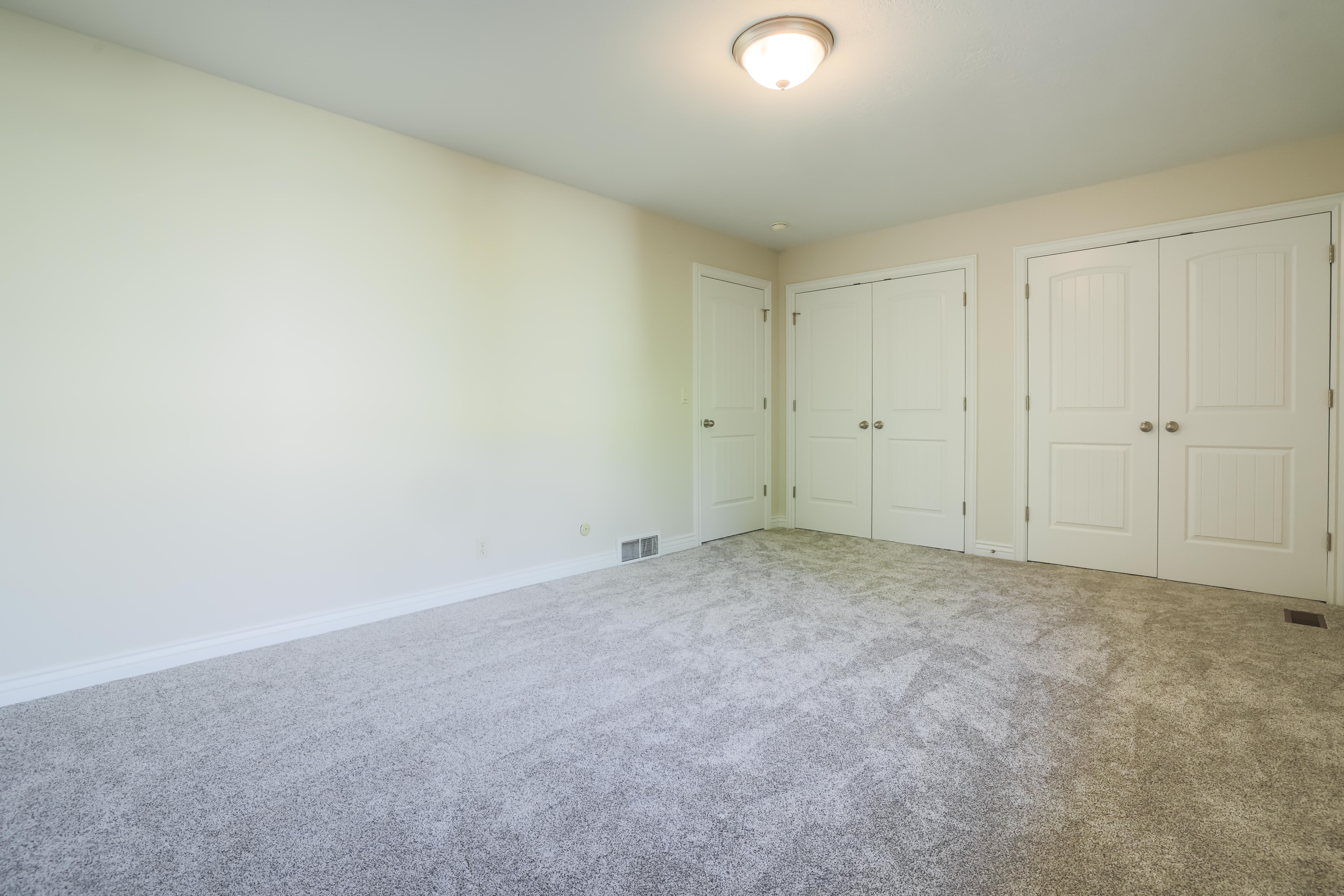 Neutral-toned walls complement the new carpeting