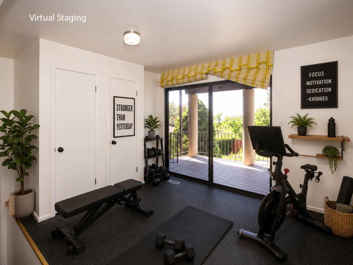 Room with black rubber flooring, two white doors with black hardware, and an overhead flush-mount light fixture