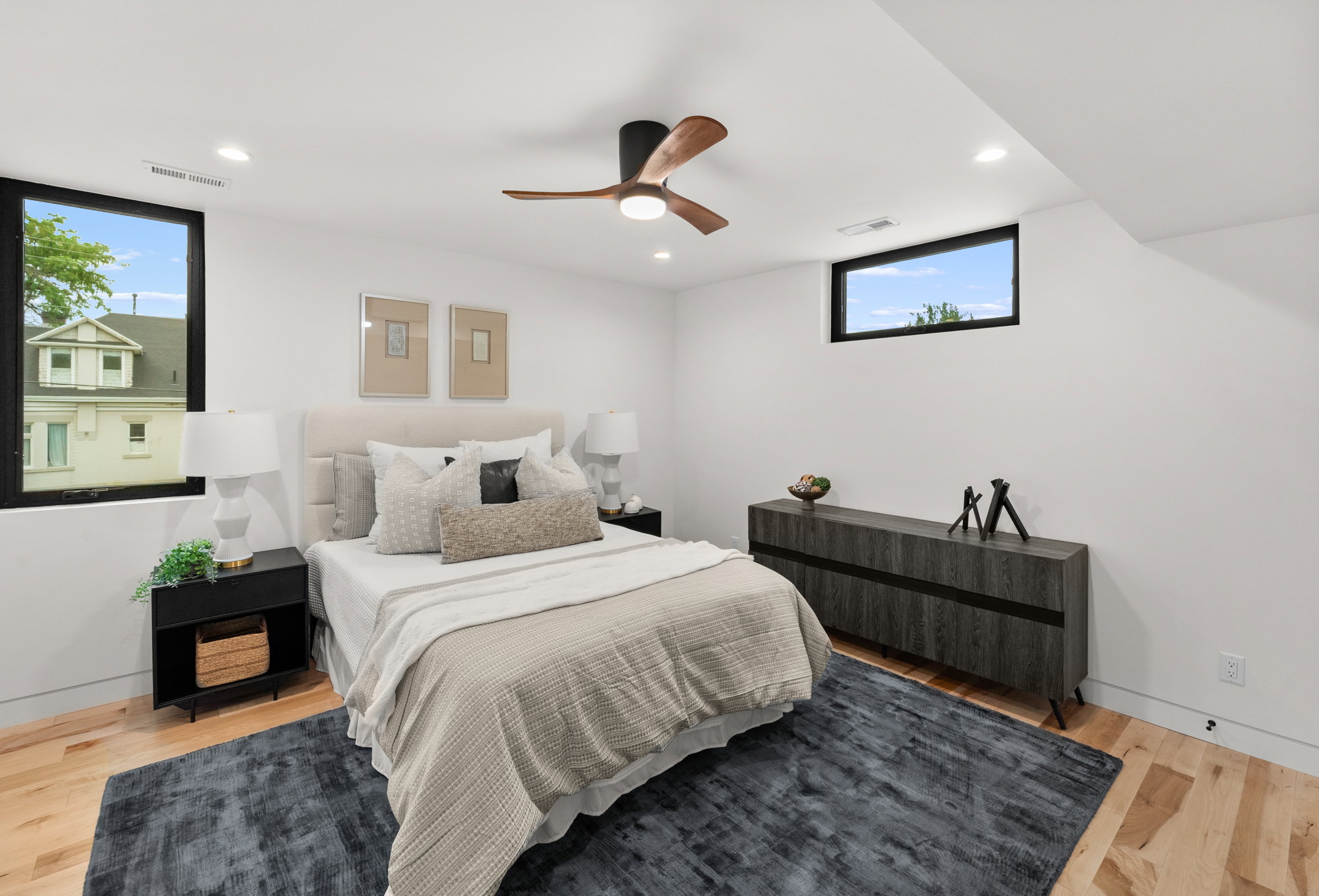 Bedroom featuring hardwood flooring and recessed lighting