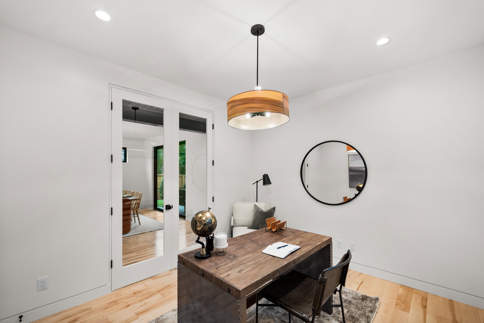 Bright interior space featuring recessed lighting and wood-finish flooring