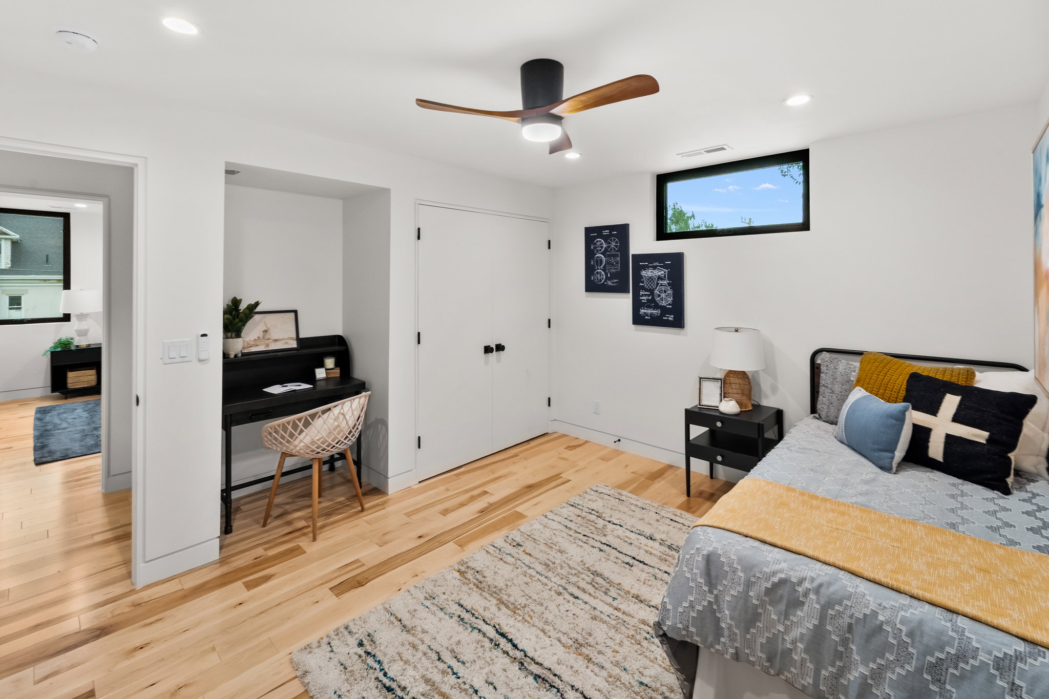 Room featuring light wood-finish flooring, recessed lighting, and a modern ceiling fan