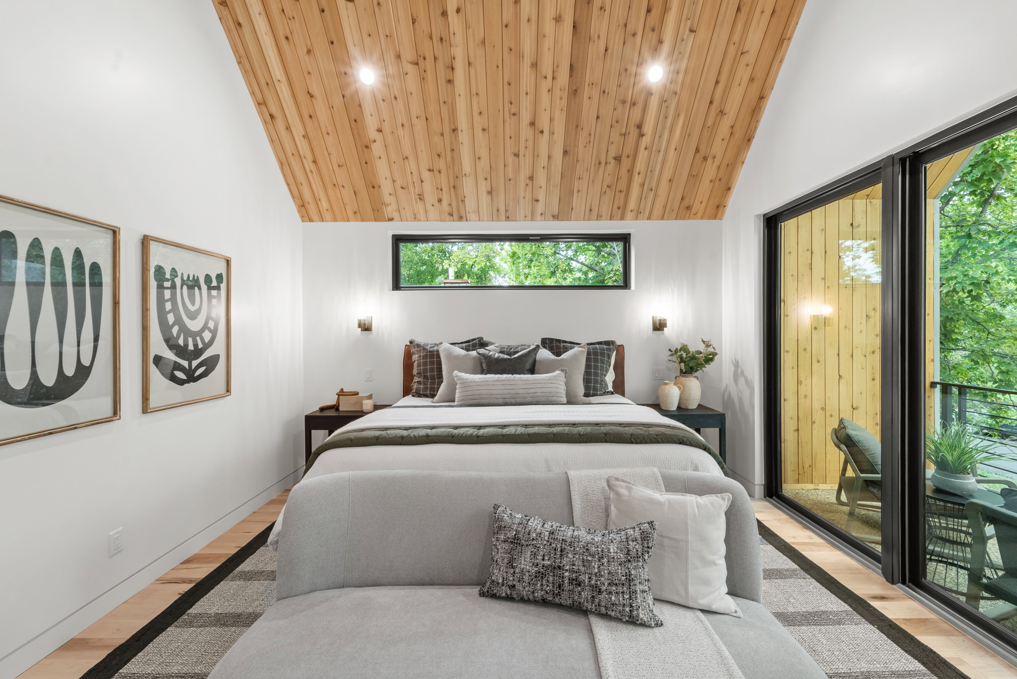 Vaulted wood-paneled ceiling with recessed lighting