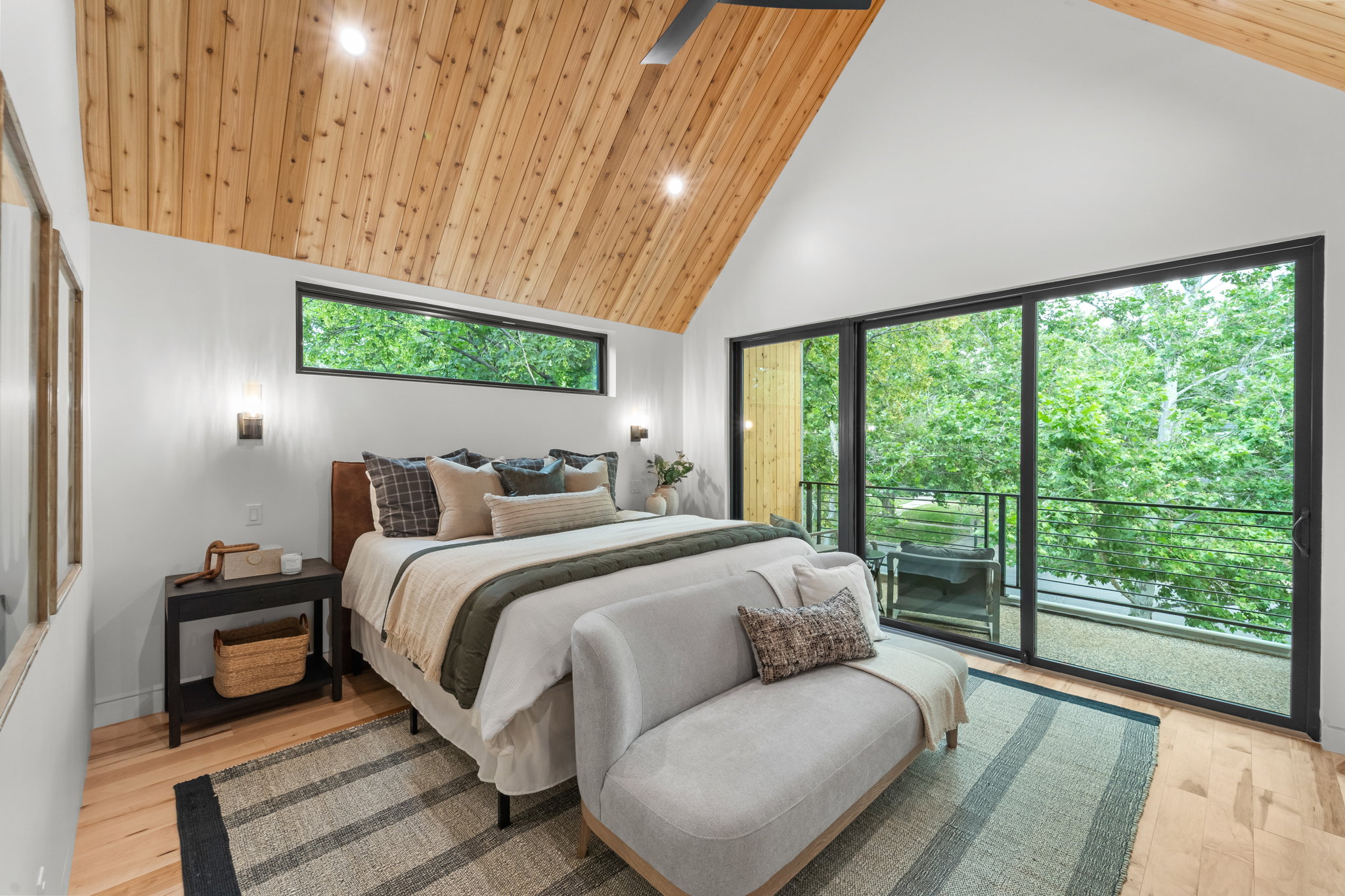 Vaulted wood-paneled ceiling with recessed lighting