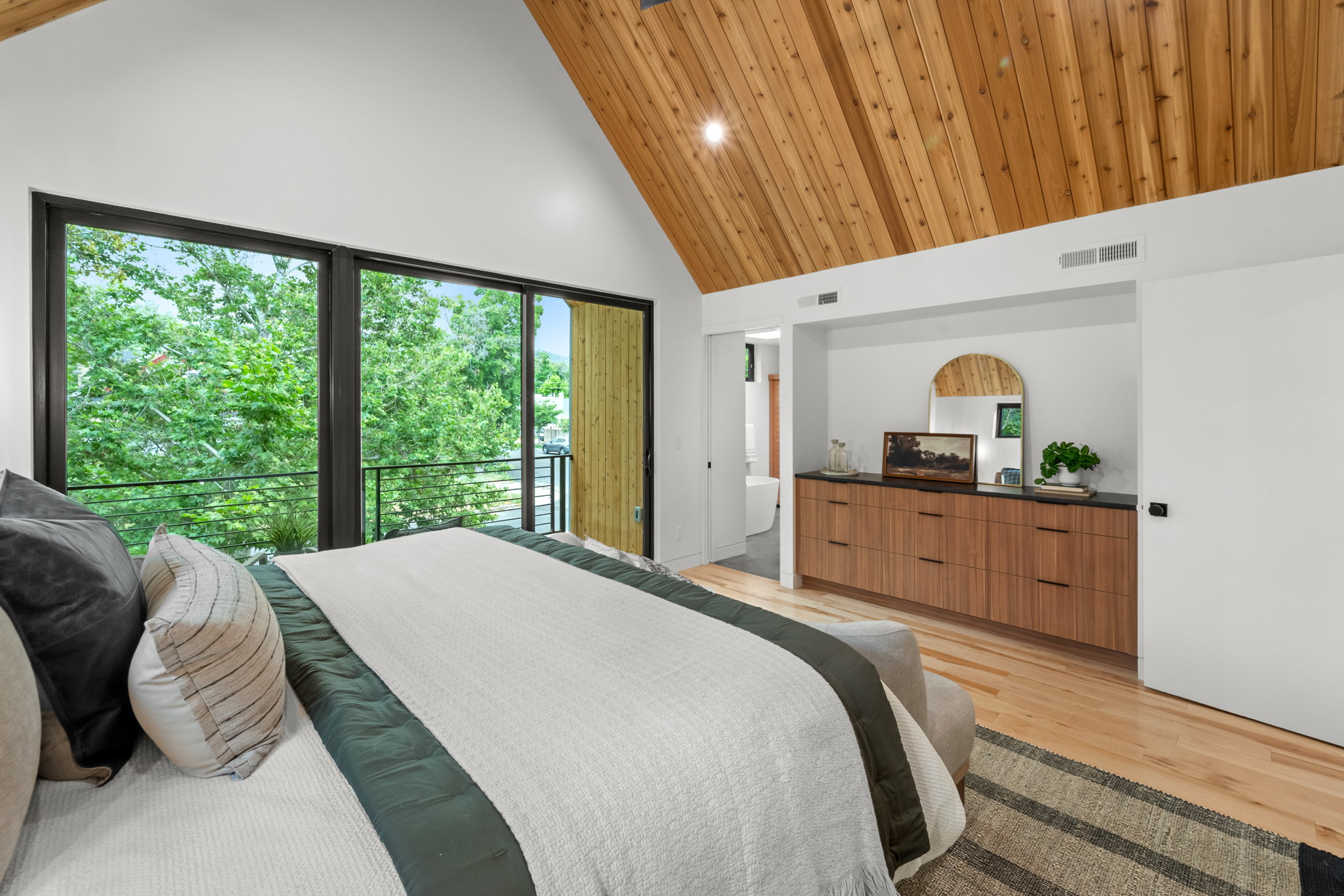 Vaulted cedar plank ceiling with recessed lighting