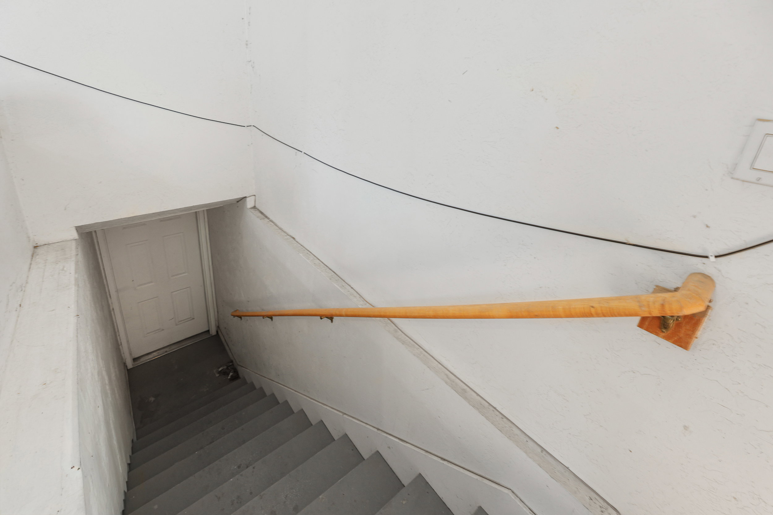 Stairs from inside garage to basement