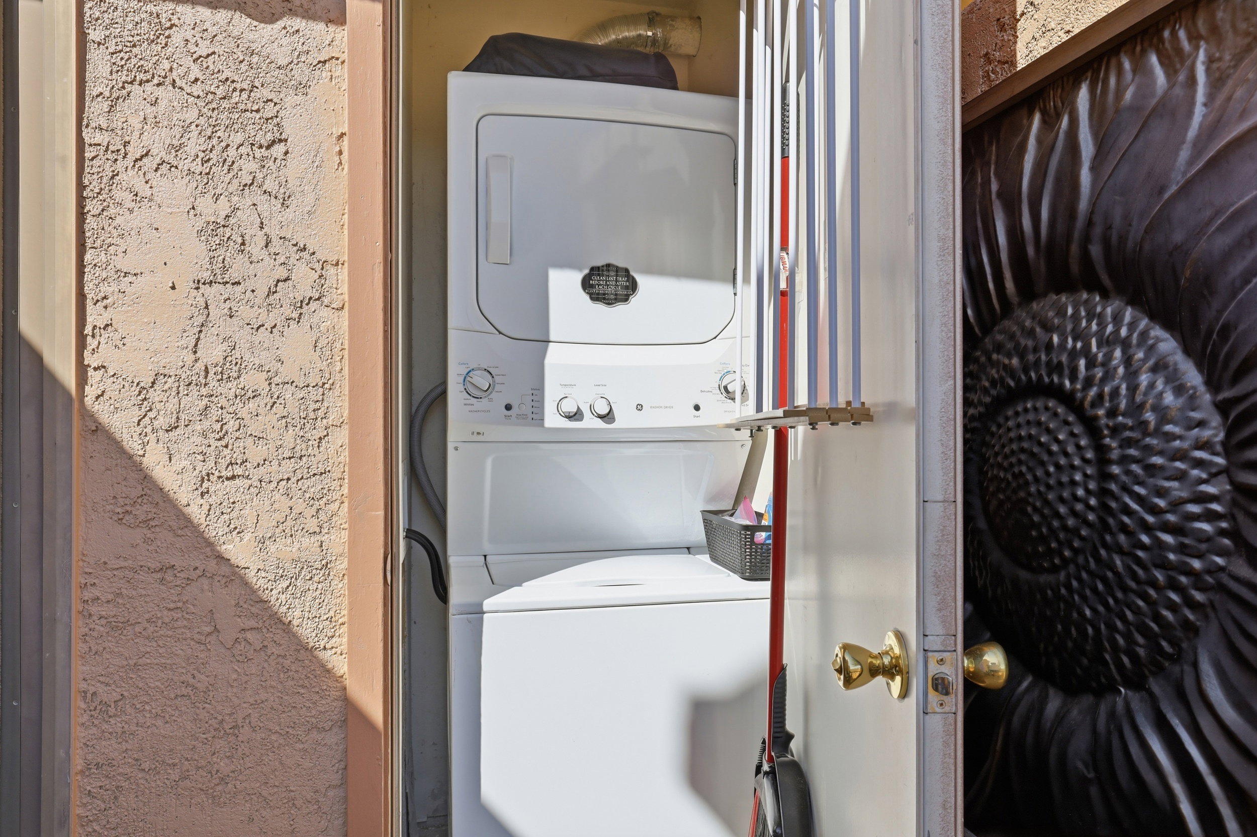 White stacked washer and dryer unit