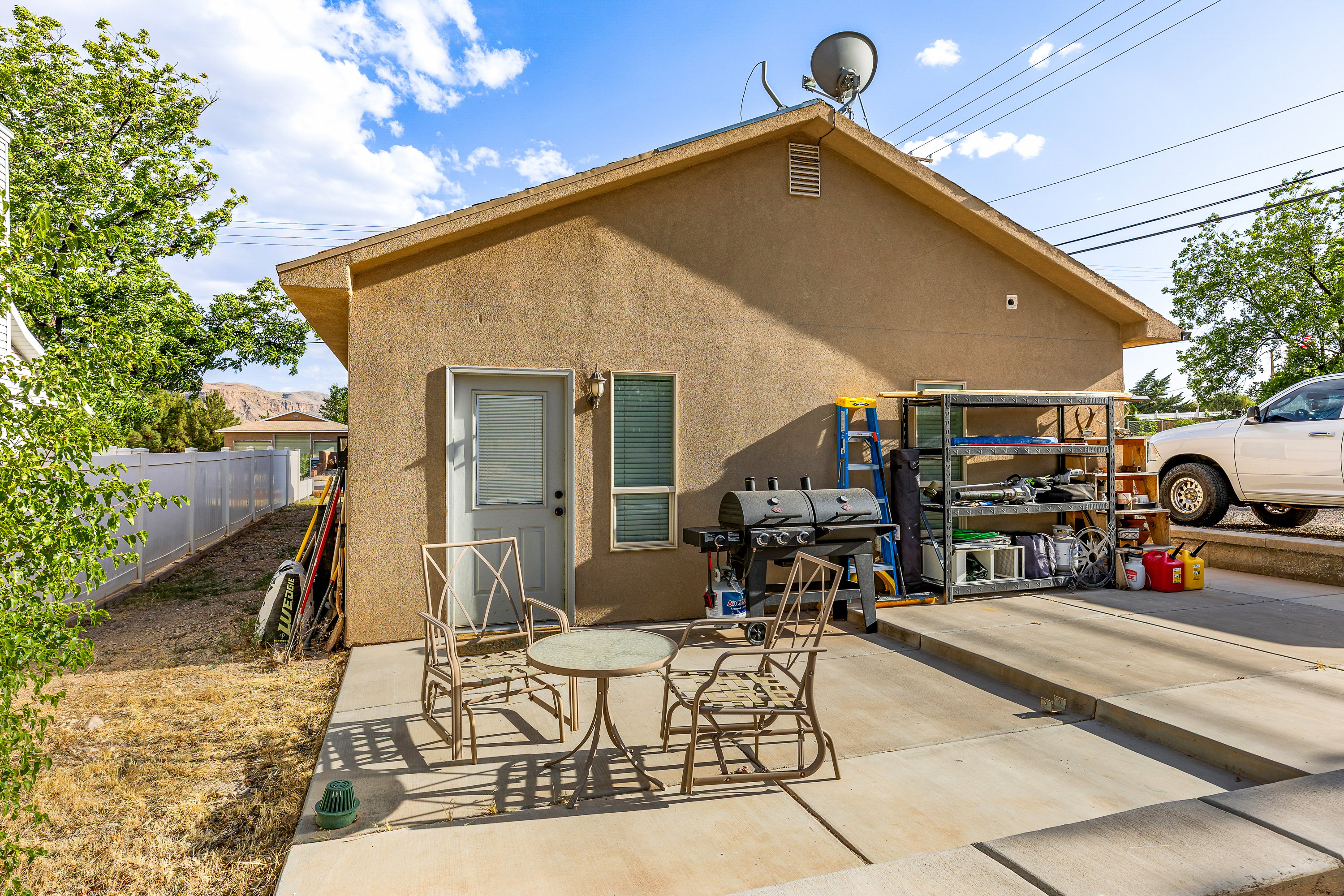Stucco exterior featuring an attached patio area