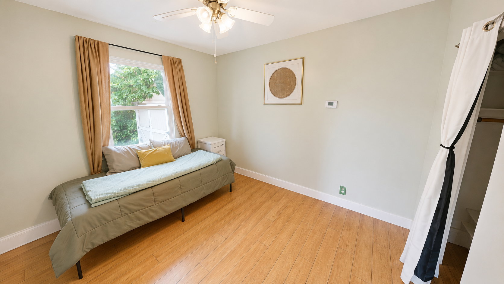 Hardwood-finish flooring complementing light-toned walls