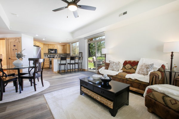 Open-concept living space featuring wood-finish flooring, recessed lighting, and a ceiling fan
