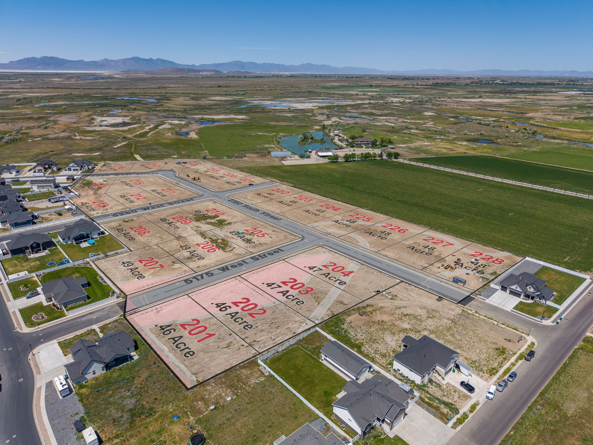 Aerial perspective showcasing an expansive development of subdivided land parcels