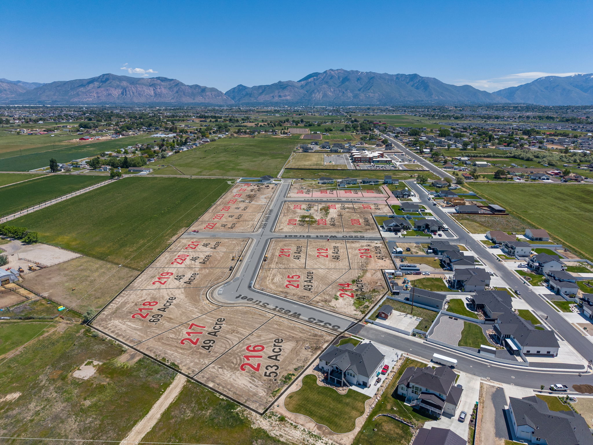 Aerial view of a developing residential subdivision with marked lots
