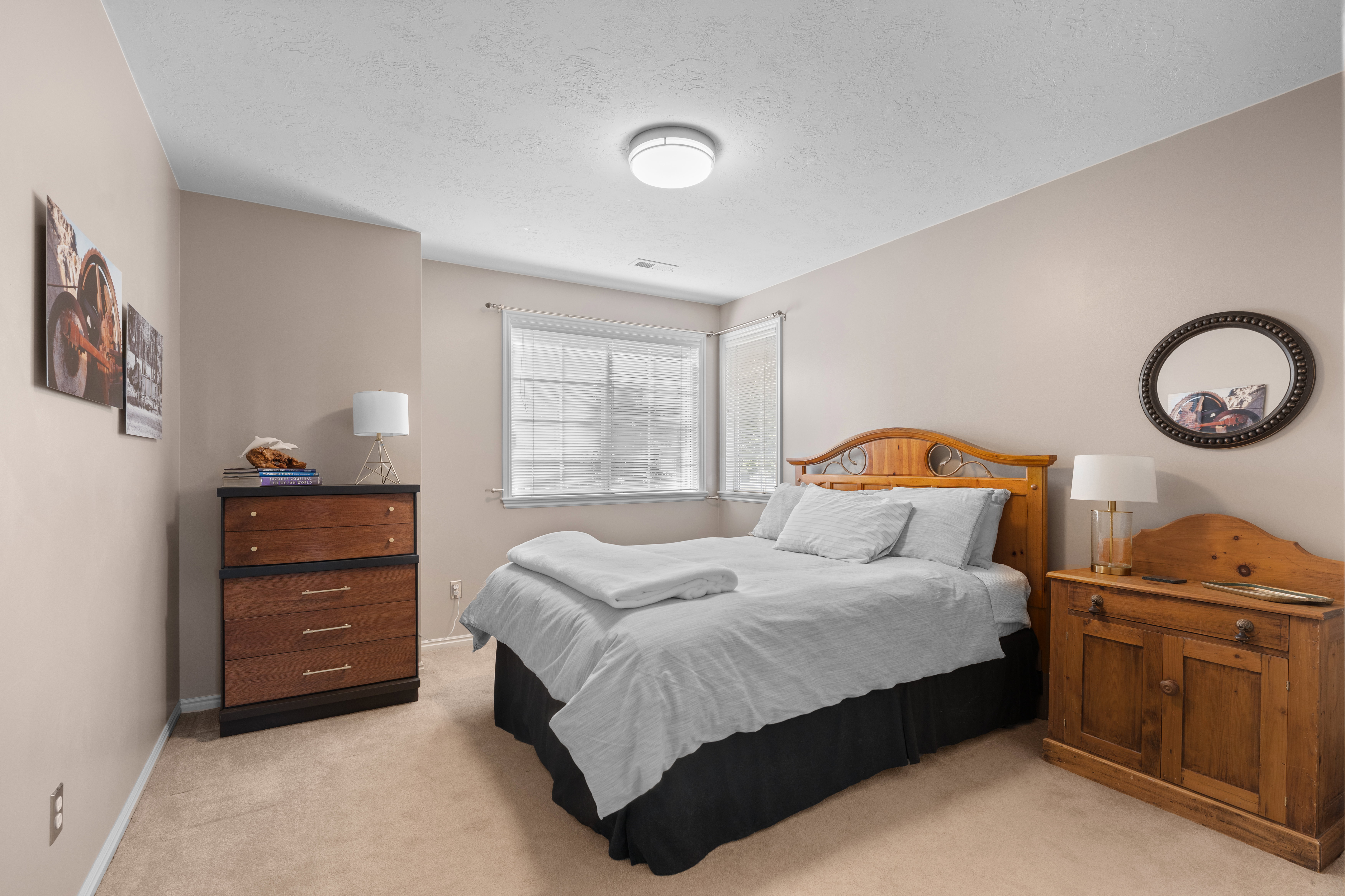 Neutral toned walls complement plush carpet flooring