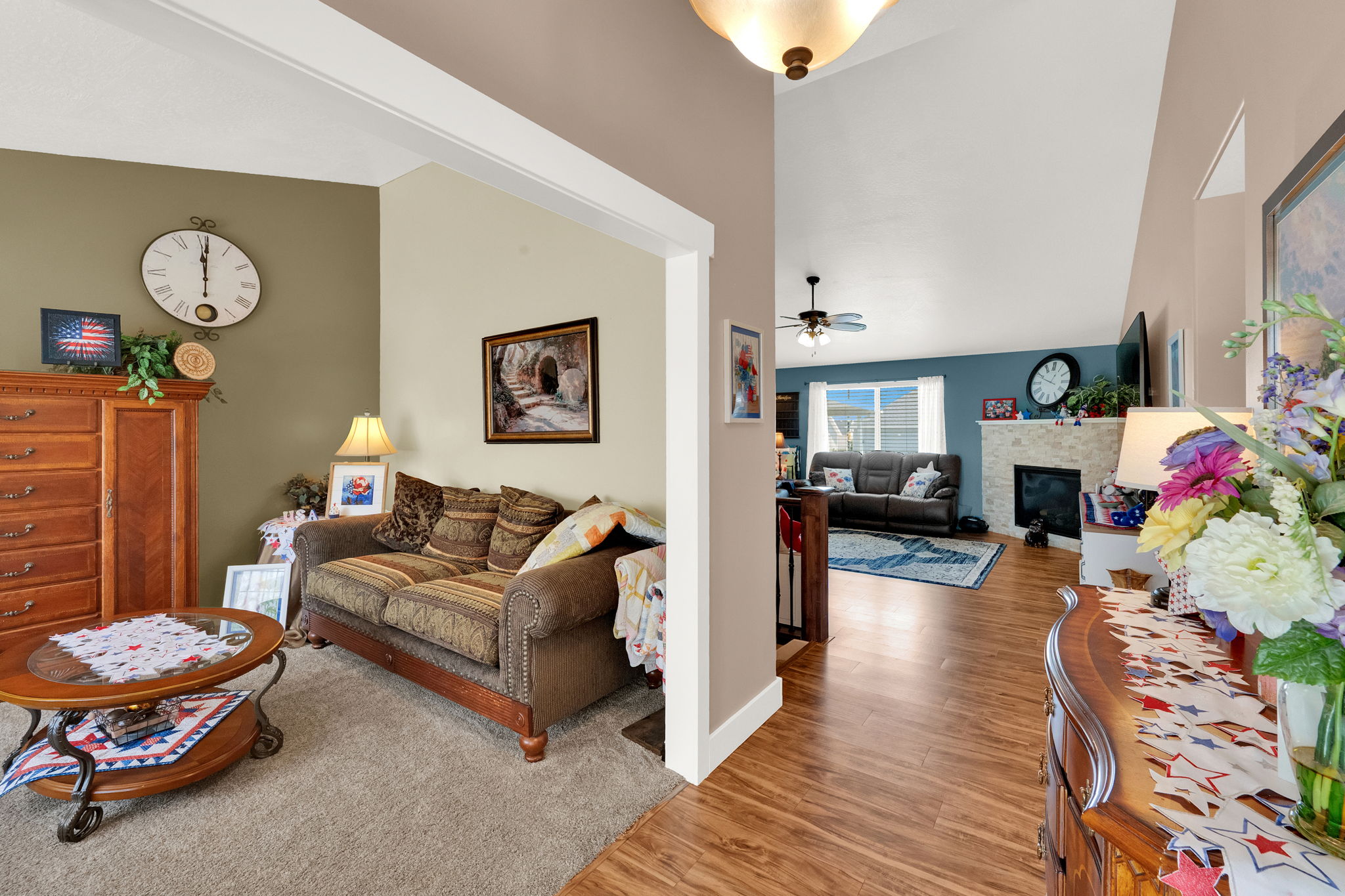 Vaulted ceilings and wood-finish flooring create an open atmosphere