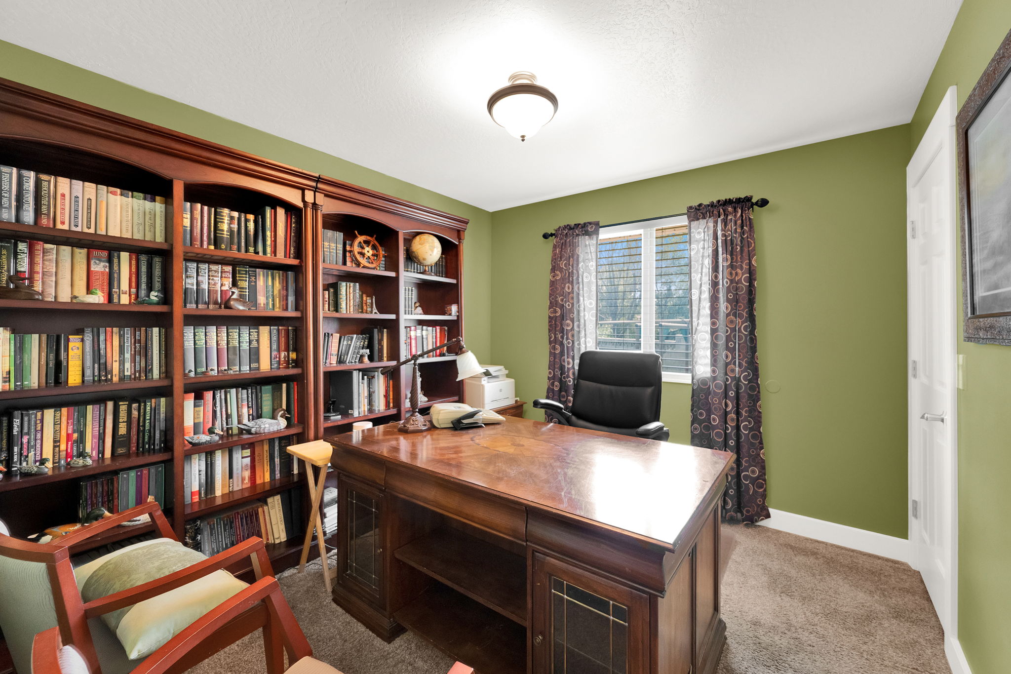 Built-in custom wood cabinetry and shelving provide extensive storage