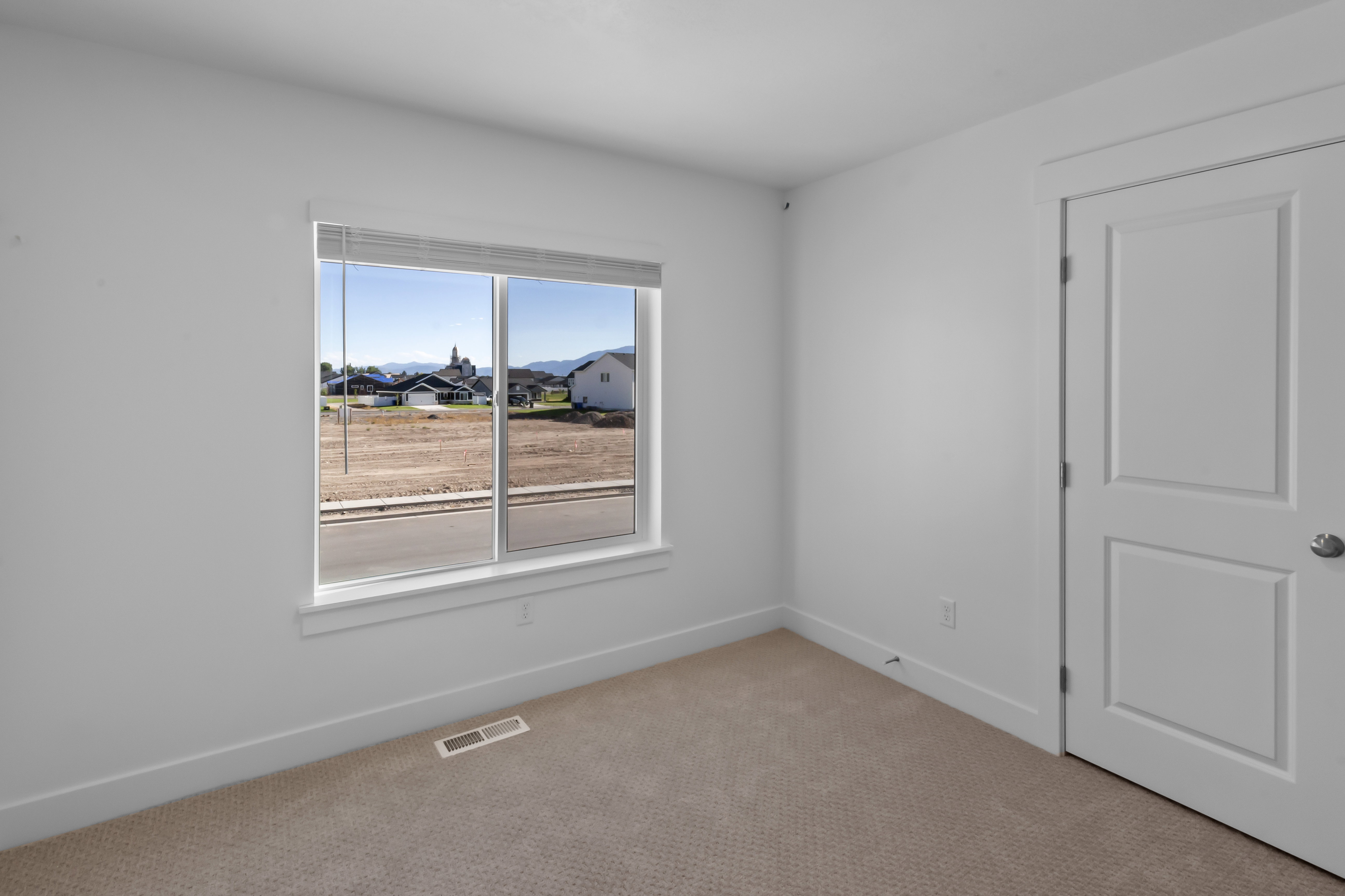 Room featuring neutral carpeting and white painted walls