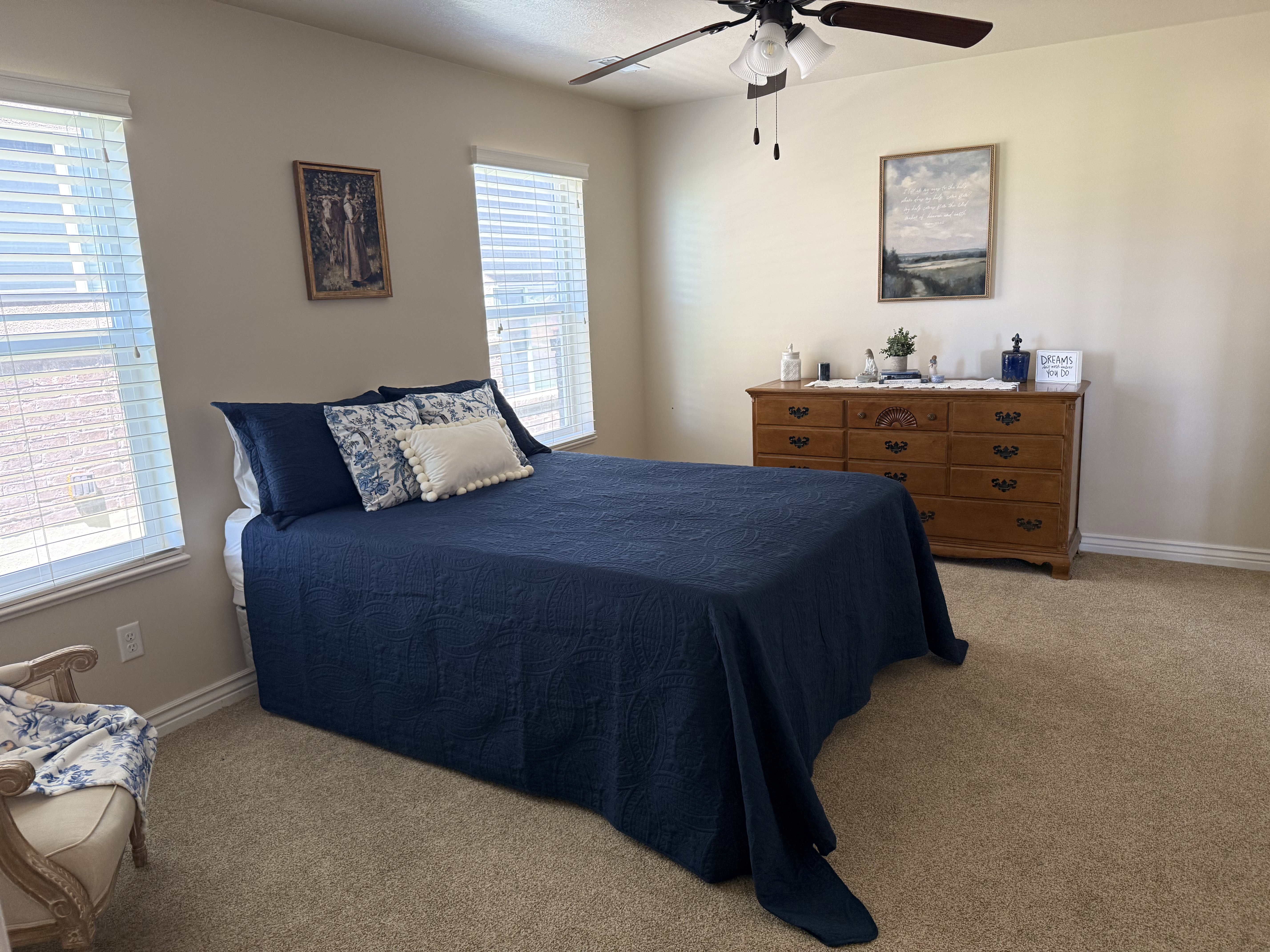 Room featuring light-colored walls and neutral carpet flooring