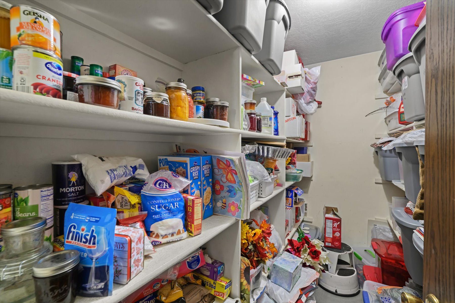 Dedicated pantry featuring extensive built-in shelving