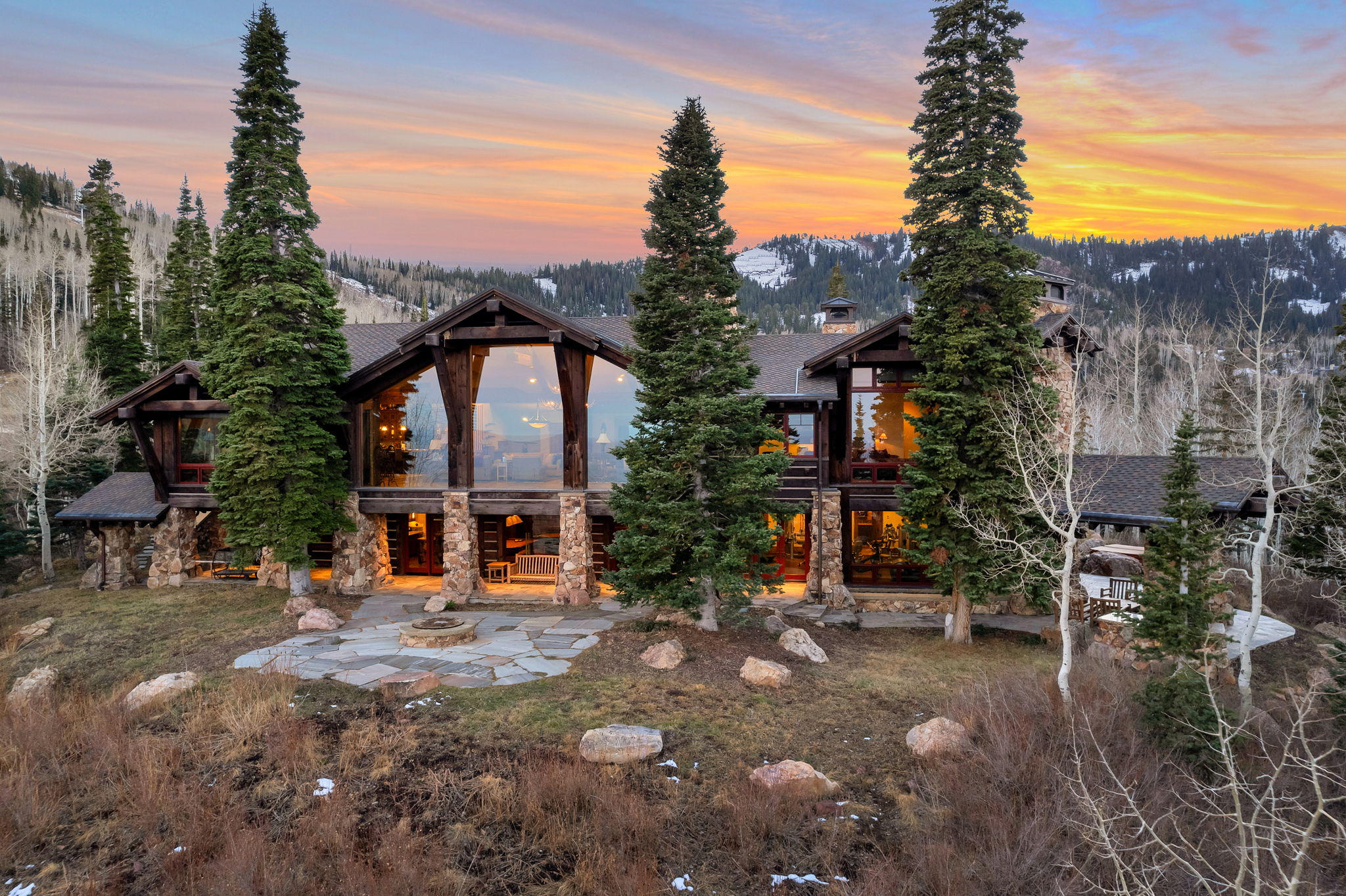Mountain-style residence featuring extensive stone and timber framing
