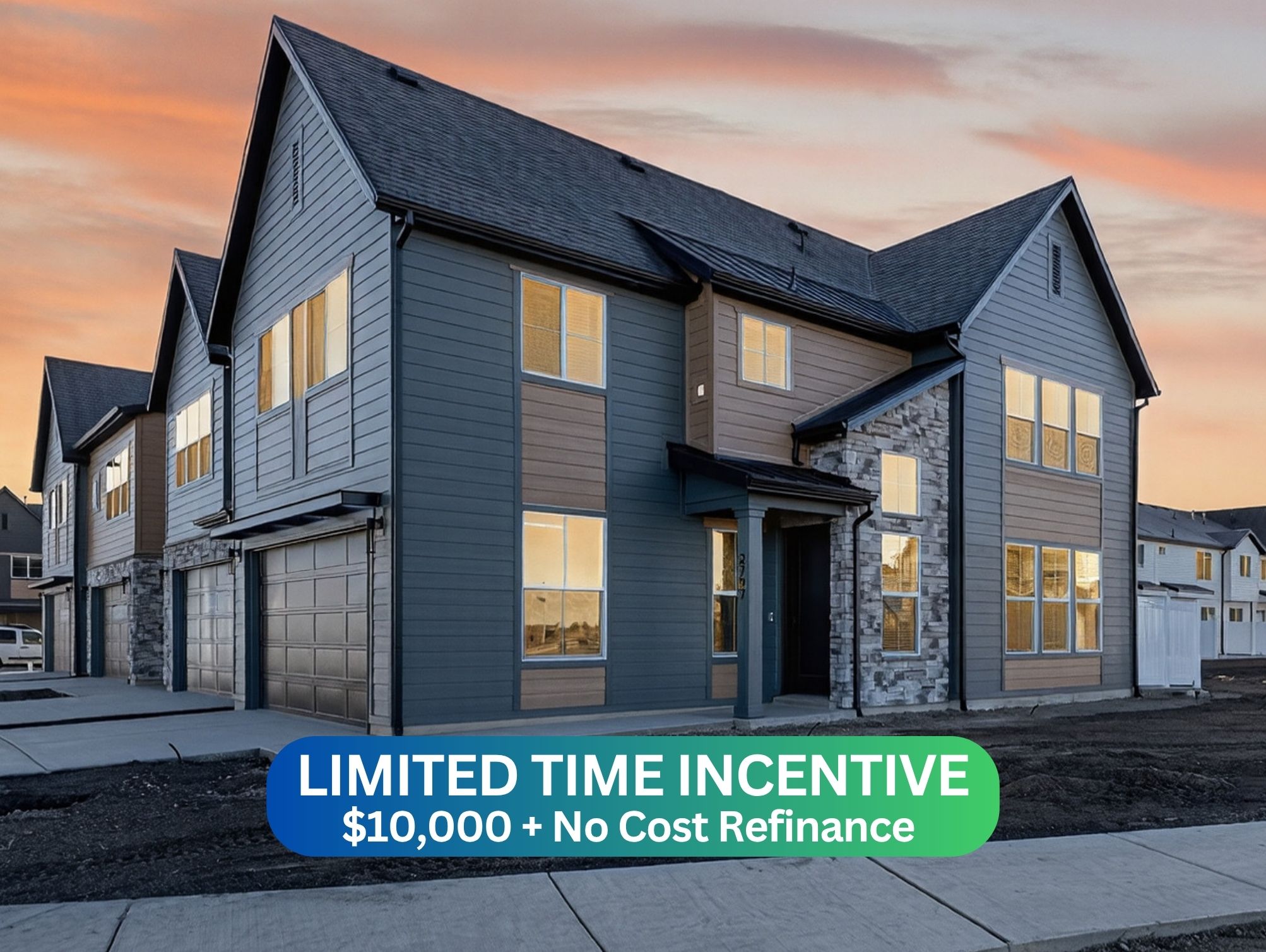 Multi-level exterior featuring varied siding, stone accents, multiple large windows, and an attached two-car garage