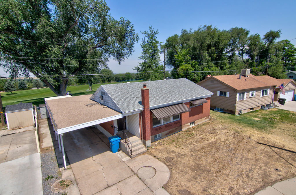 Brick and siding exterior with a shingled roof