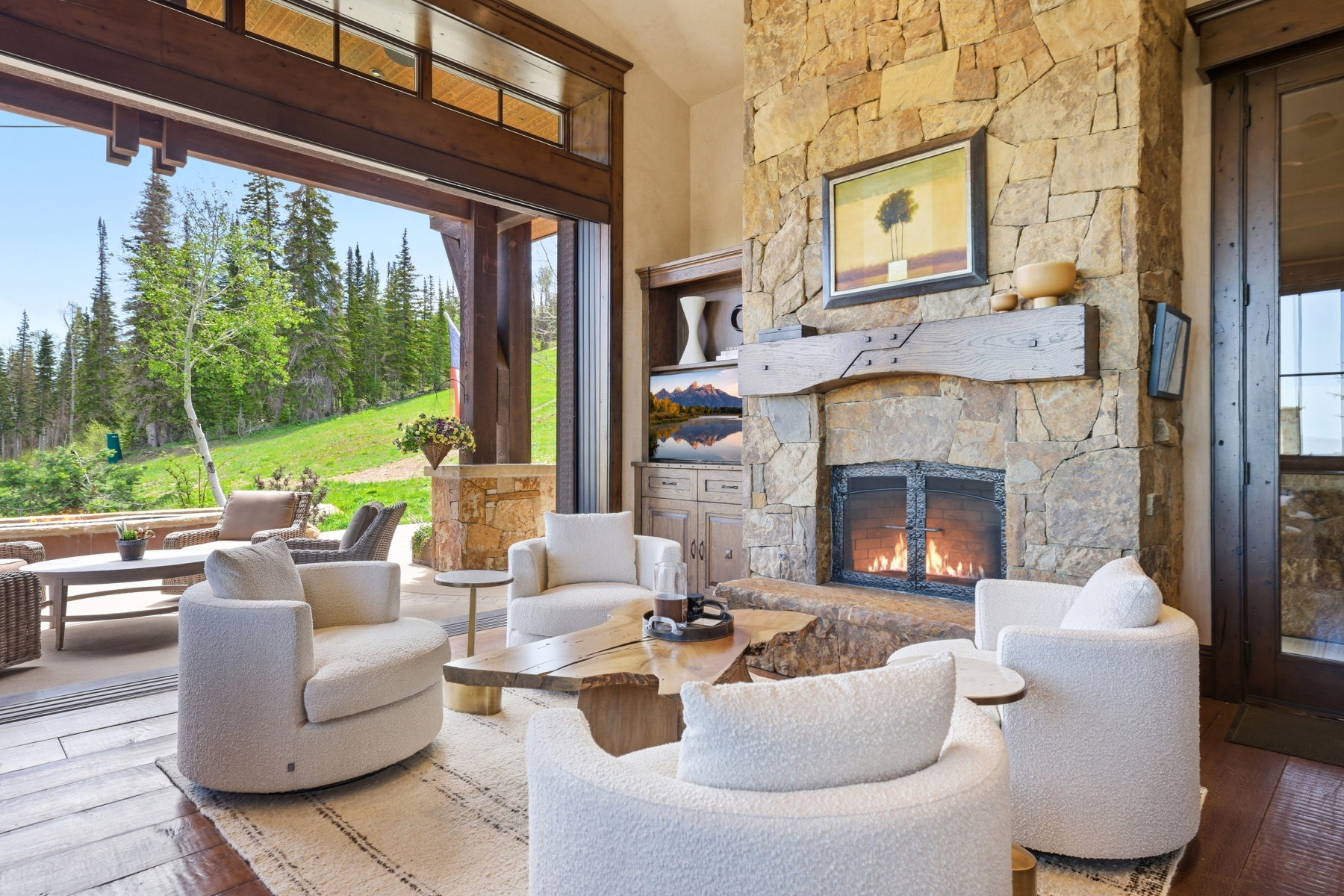 Stone-clad fireplace with a substantial timber mantel