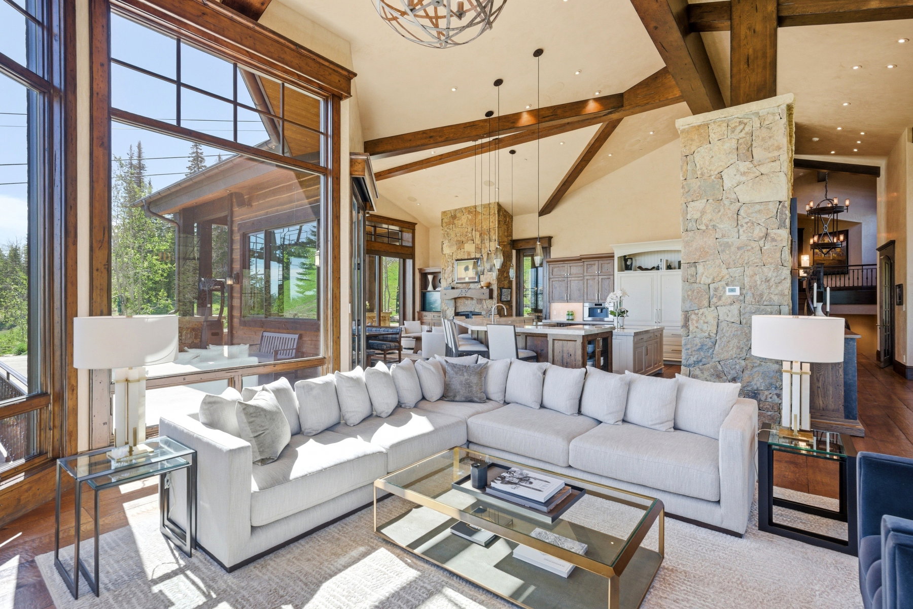 Vaulted ceilings with exposed wood beams define this open living area