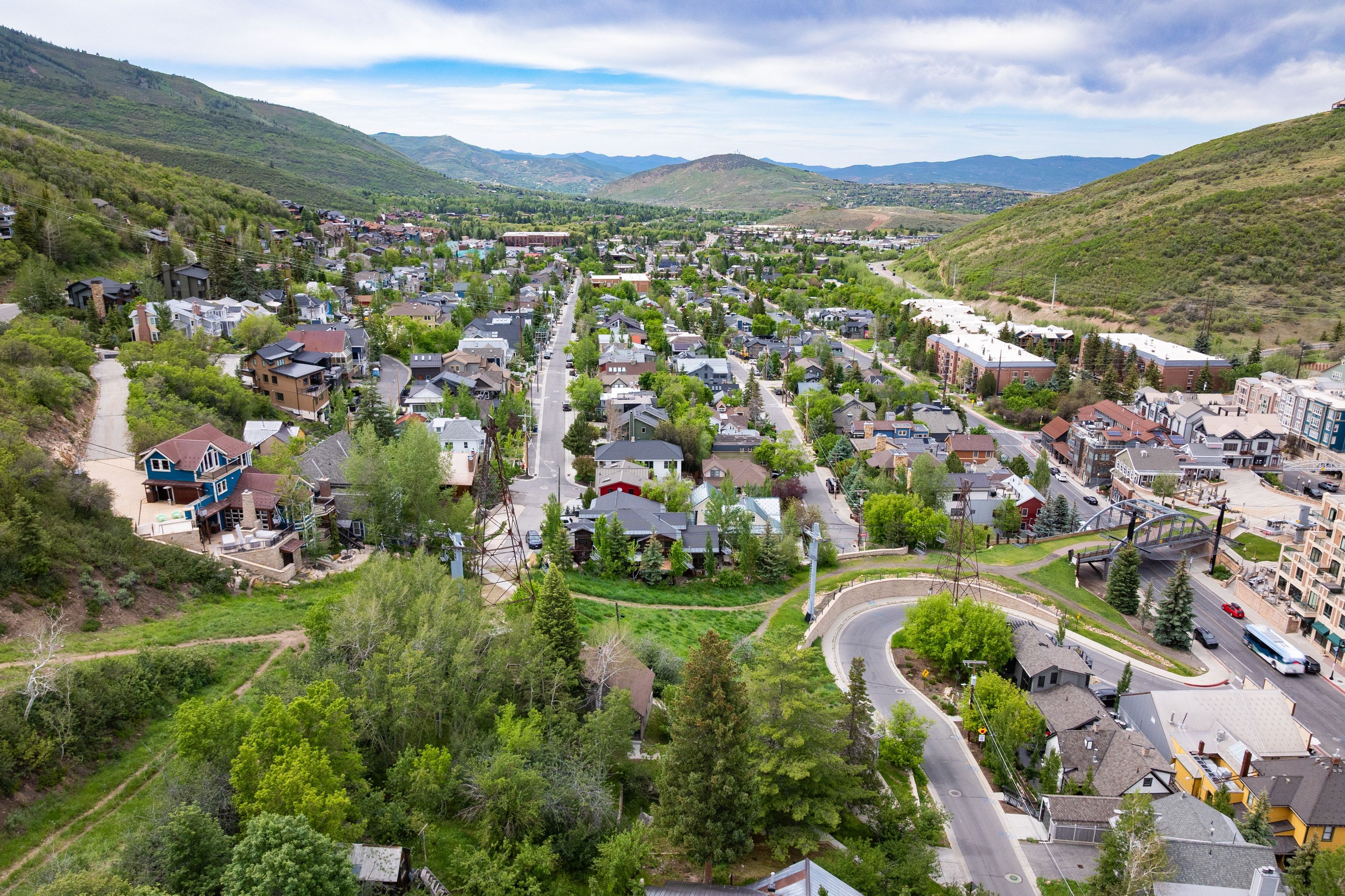 Aerial perspective showcasing a residential community nestled within a mountainous landscape