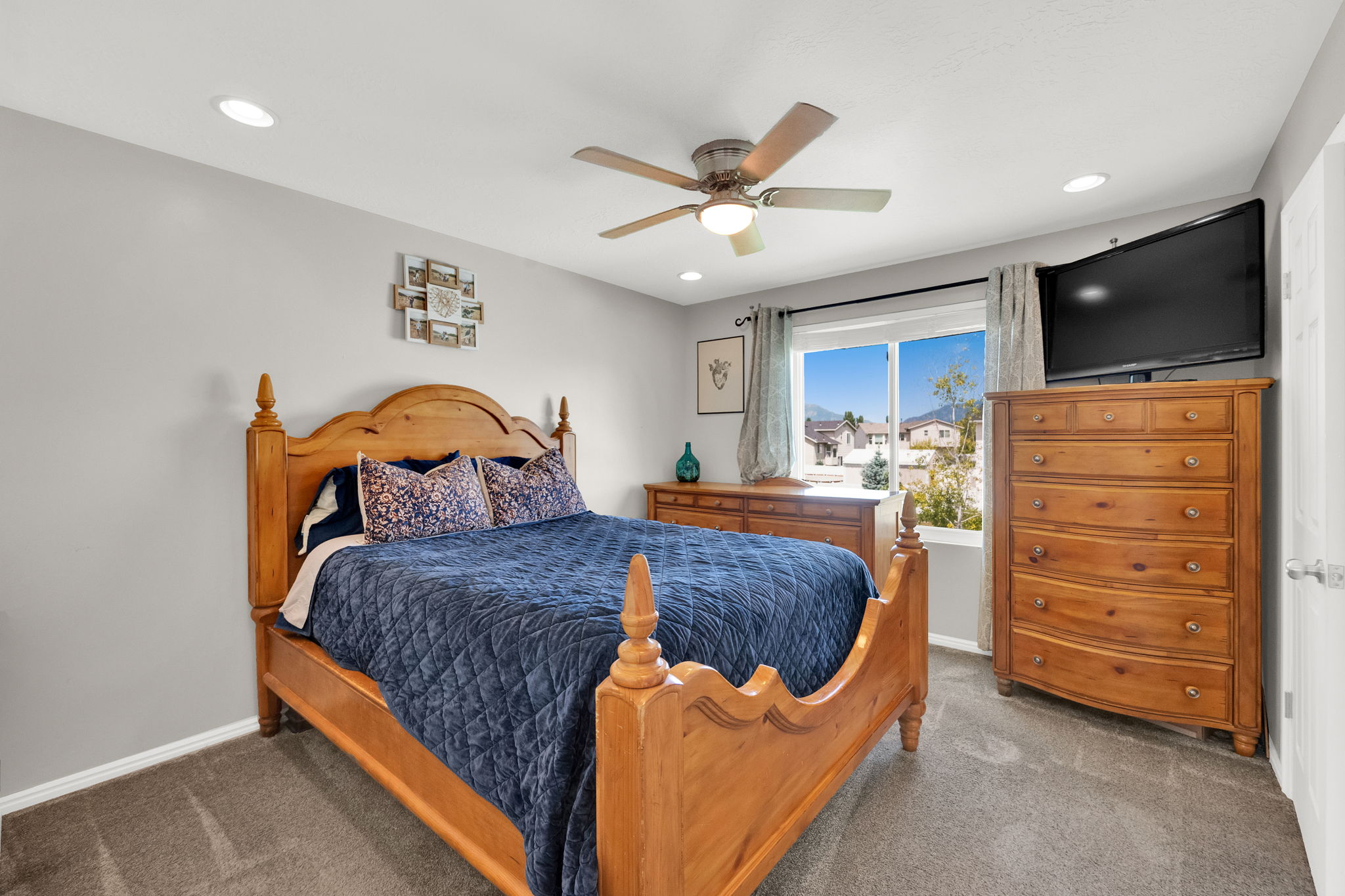 Carpeted room featuring recessed lighting and a ceiling fan