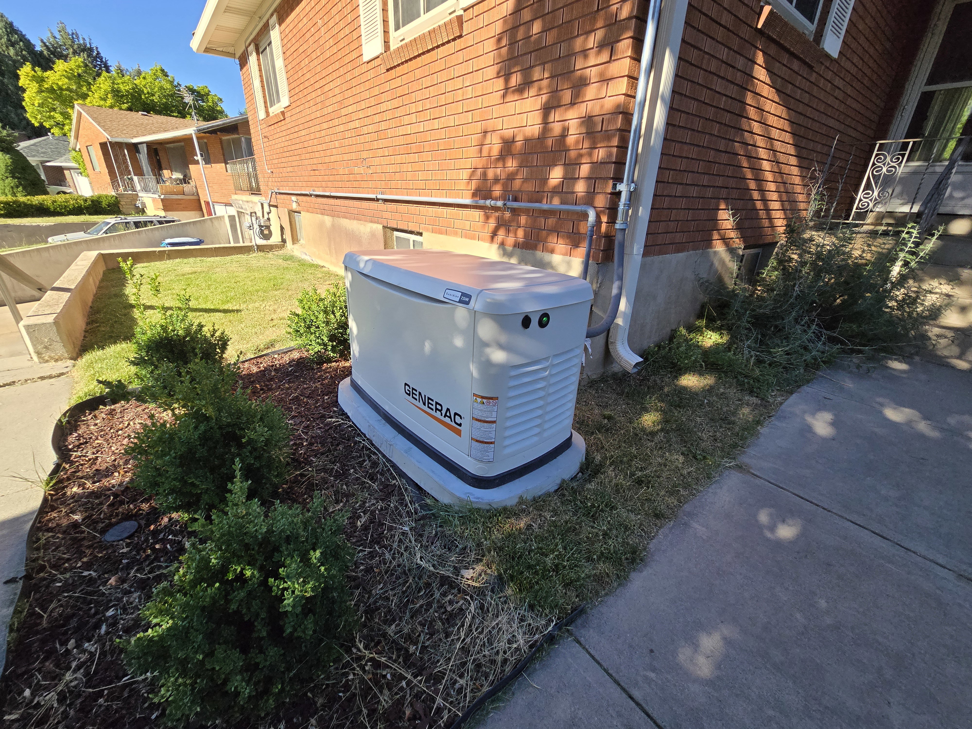 Generac whole-home generator unit positioned on a concrete pad