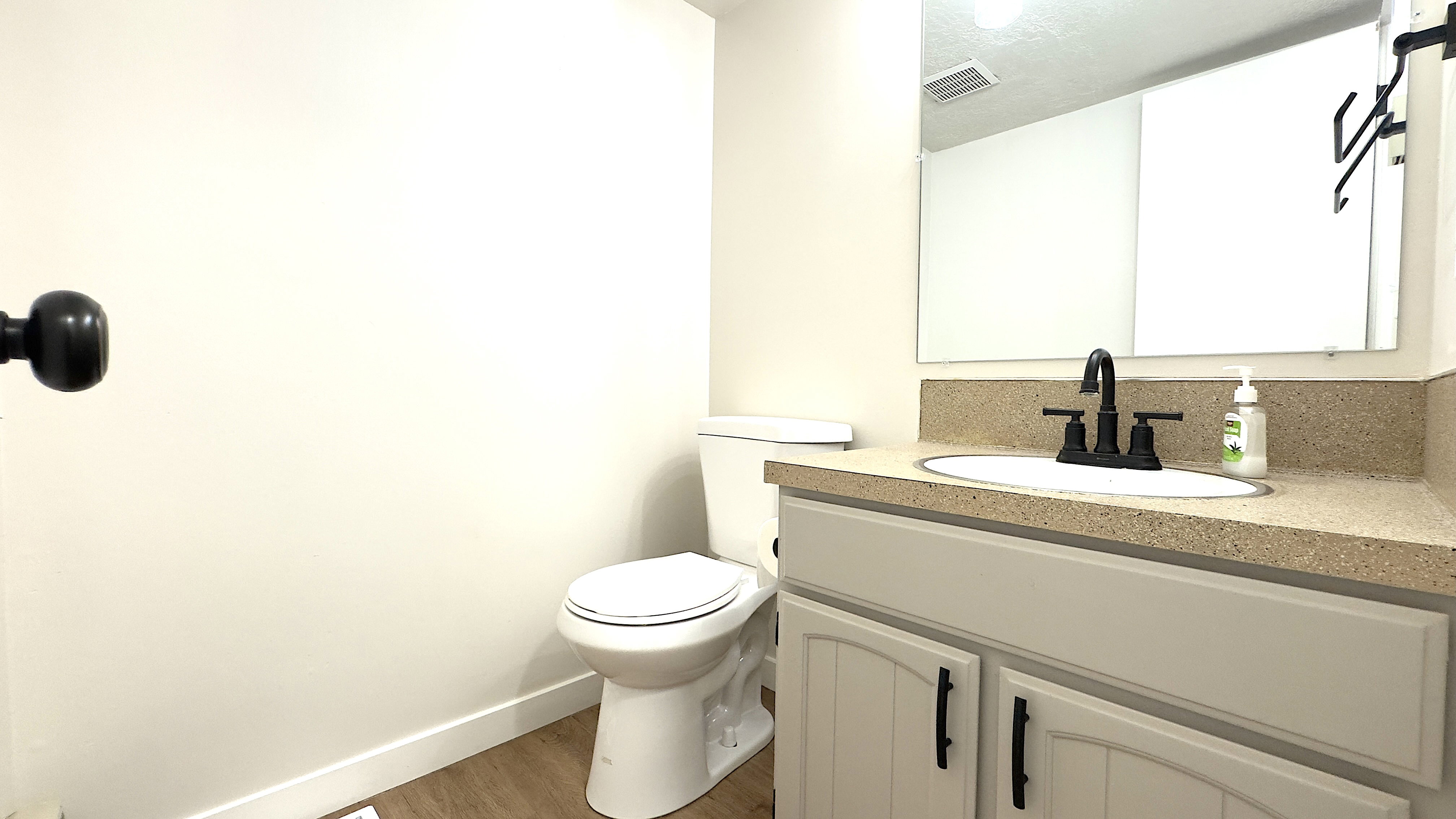 Main level 1/2 bathroom just off the kitchen/living room area.