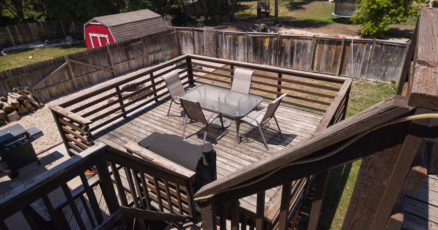 Multi-level wood deck featuring slatted railings