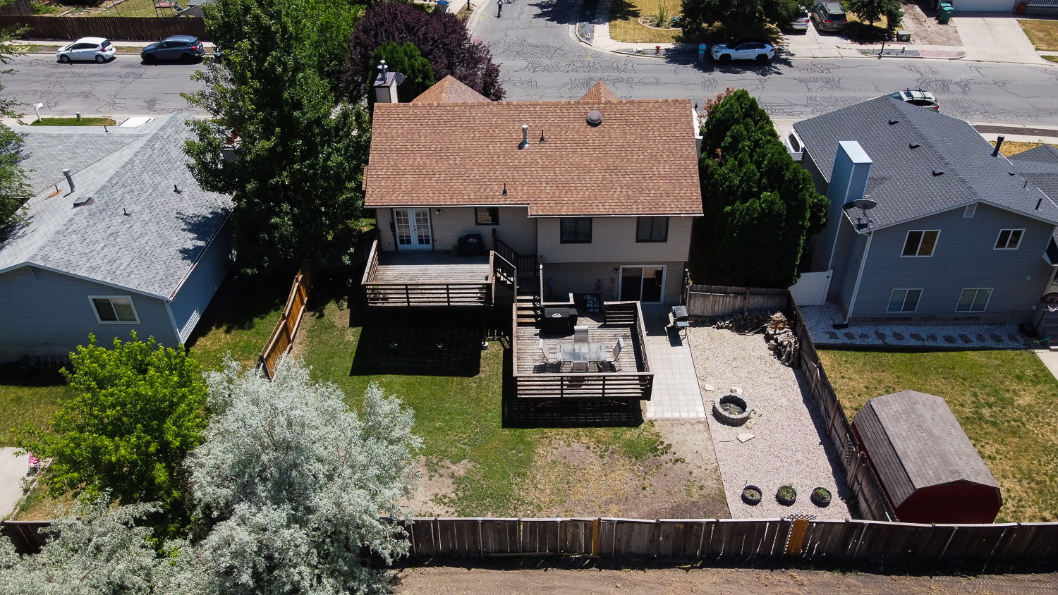 Two-story residence with a brown shingle roof