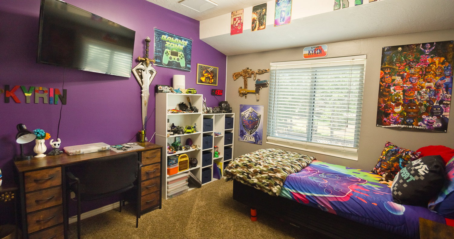 Neutral-toned carpet flooring complements the room's two-tone wall treatment