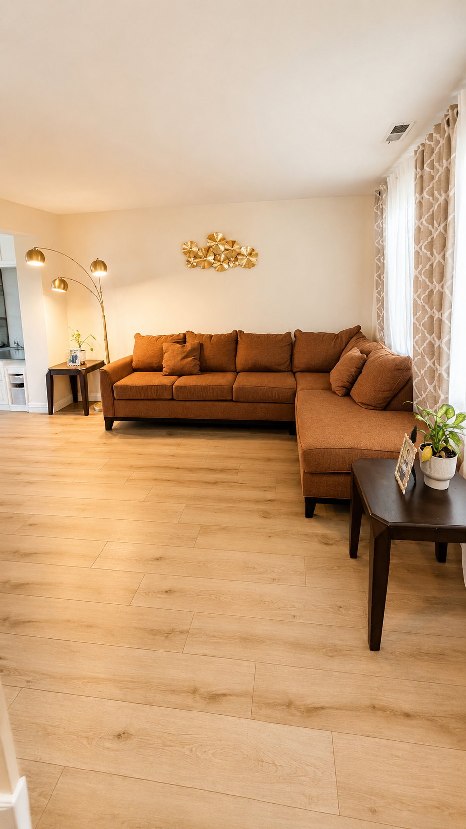 Light wood-finish flooring throughout the room