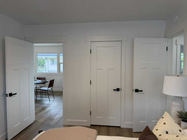 White shaker-style doors with black hardware
