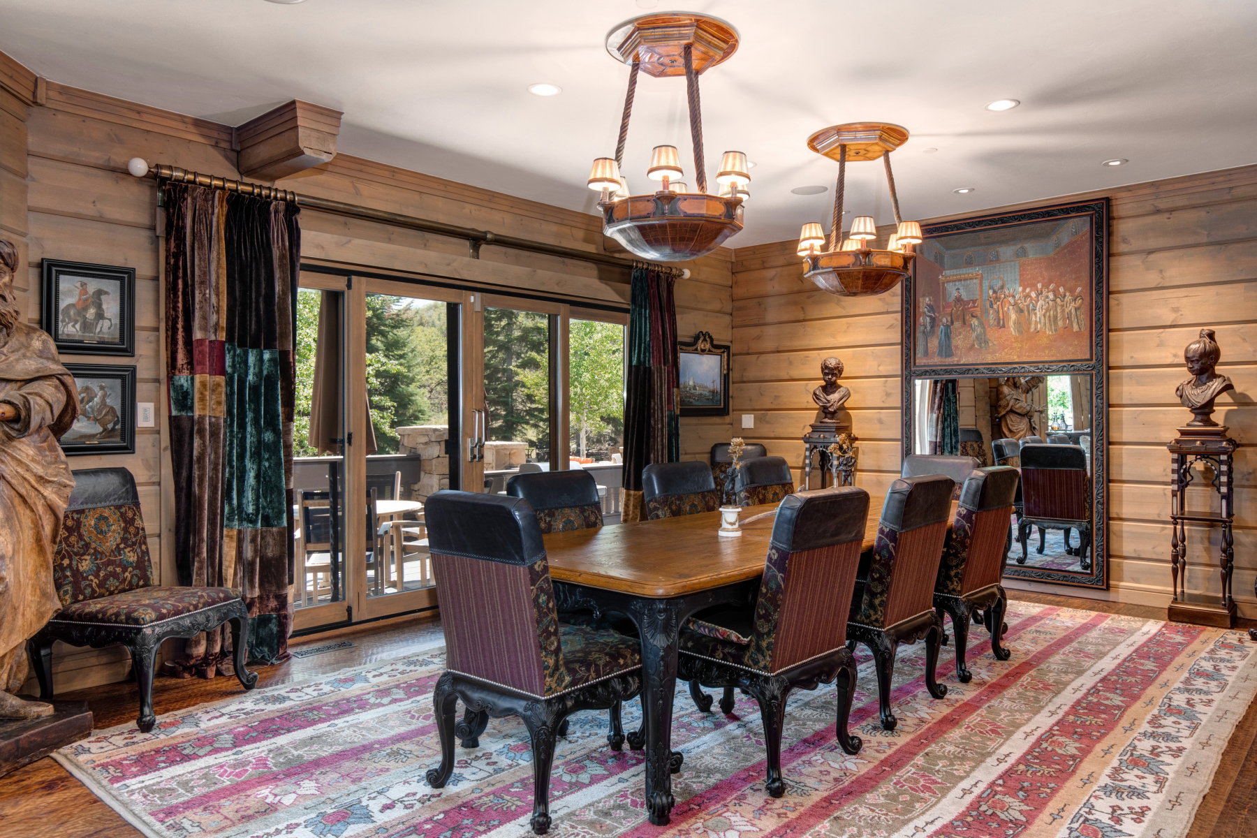 Dining area featuring wood-paneled walls and matching wood-finish flooring