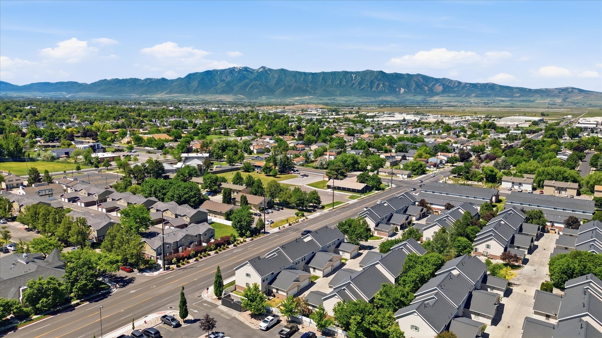 Aerial perspective showcasing a residential community with distant mountain range