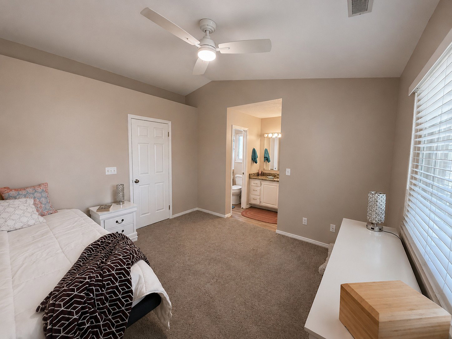 Carpeted room with a ceiling fan, recessed lighting, and white baseboards