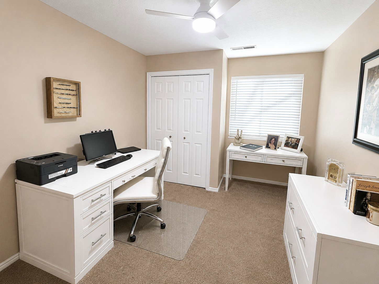 Carpeted room featuring neutral wall tones and a white ceiling fan with integrated lighting